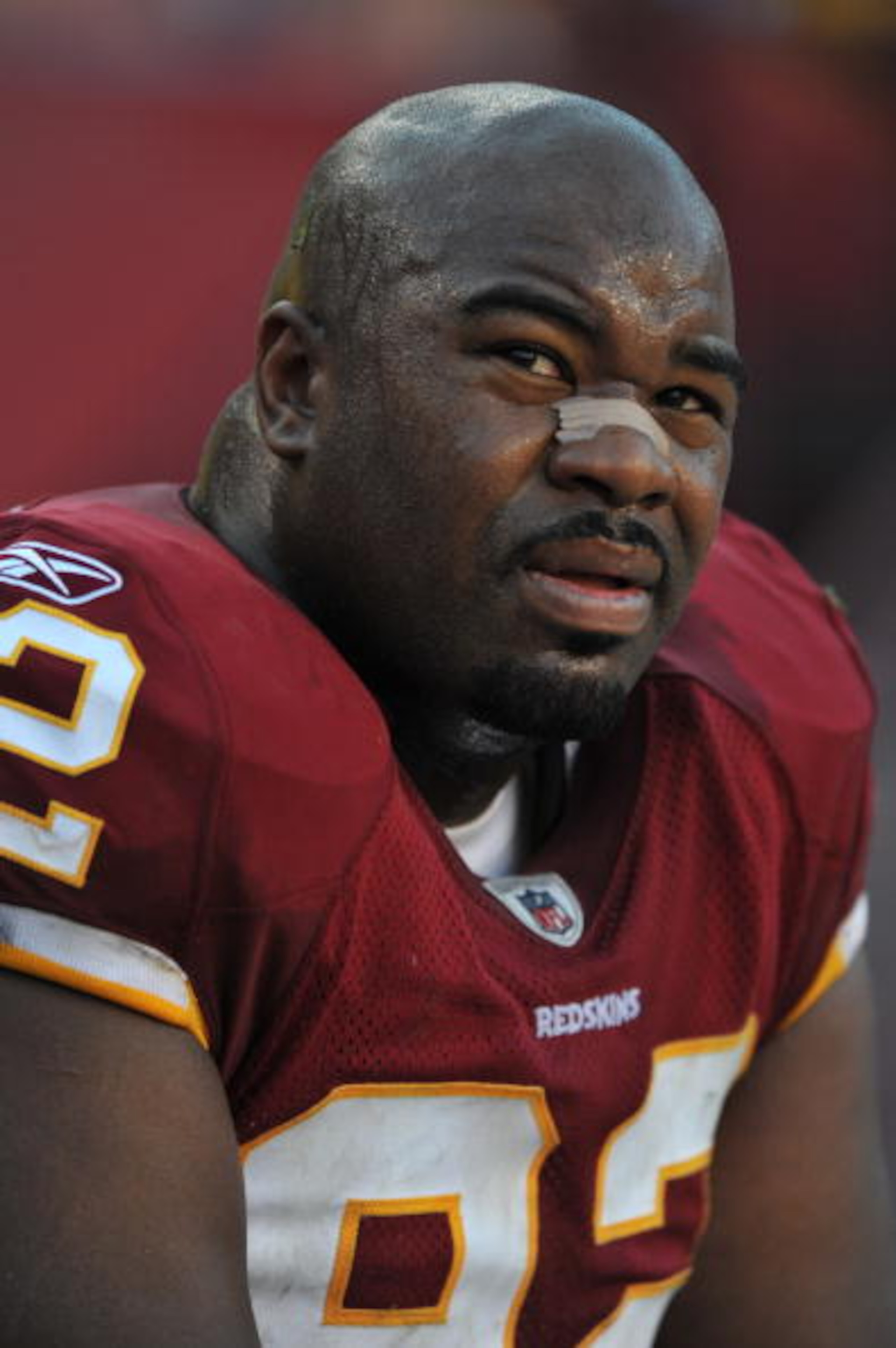 LANDOVER, MD - NOVEMBER 15:  Albert Haynesworth #92 of the Washington Redskins sits on the sidelines during the game against the Denver Broncos at FedExField on November 15, 2009 in Landover, Maryland. The Redskins defeated the Broncos 27-17. (Photo by La