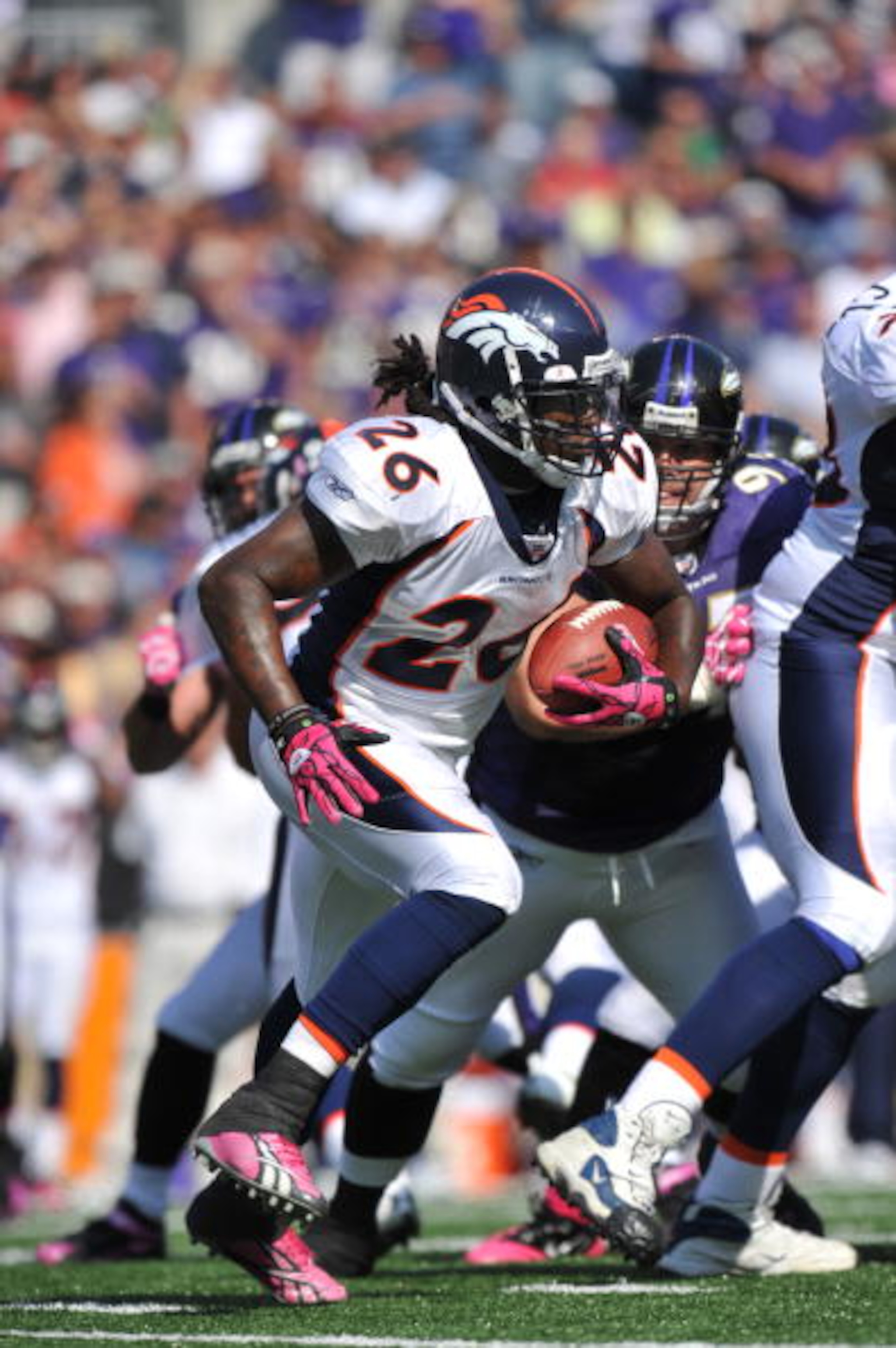 BALTIMORE, MD - OCTOBER 10: Laurence Maroney #26 of the Denver Broncos runs the ball against the Baltimore Ravens at M&T Bank Stadium on October 10, 2010 in Baltimore, Maryland. Players wore pink in recognition of Breast Cancer Awareness Month. The Ravens