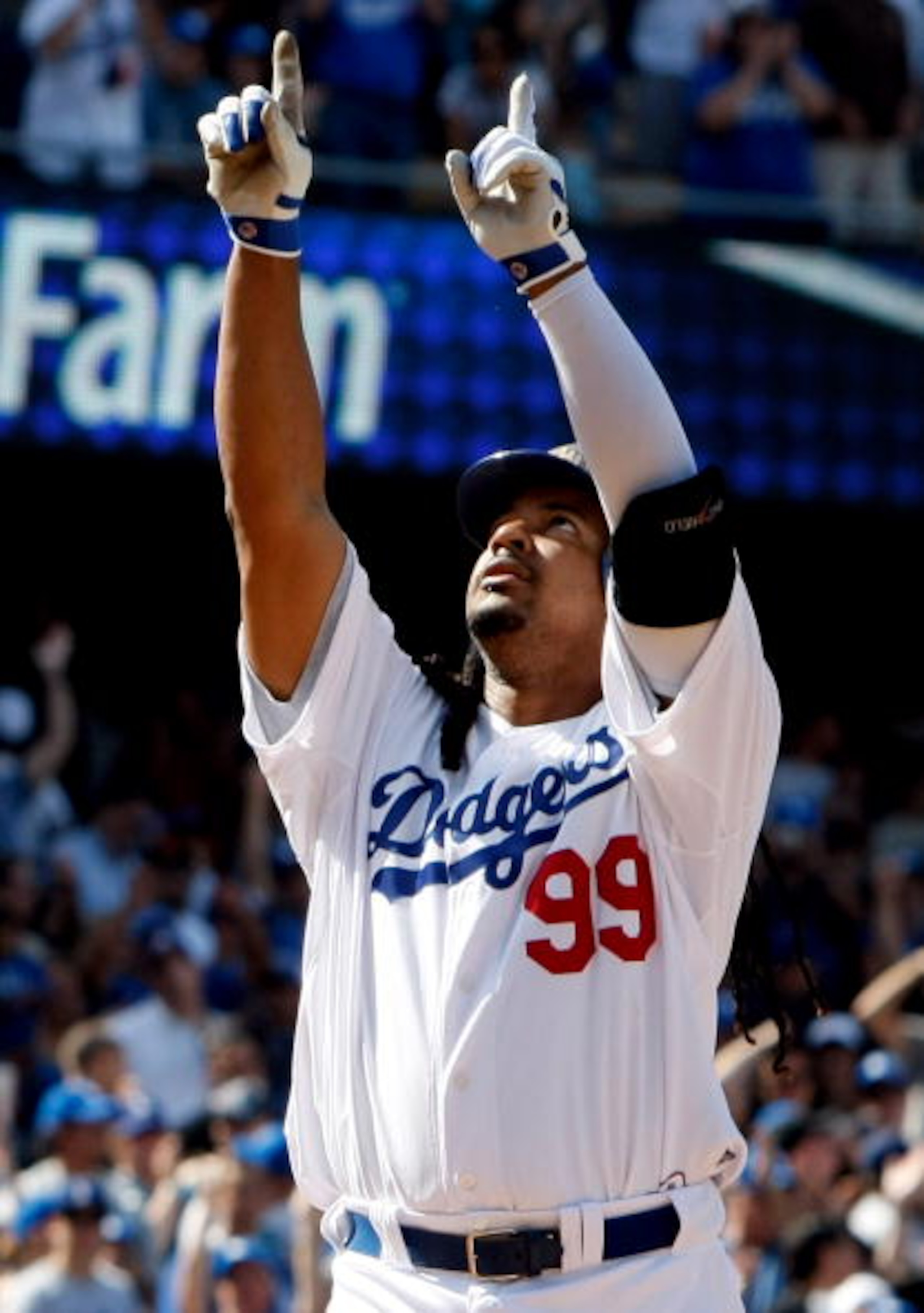 LOS ANGELES, CA - APRIL 18: Manny Ramirez #99 of the Los Angeles Dodgers celebrates after hitting a two-run homerun in the eighth inning against the San Francisco Giants at Dodger Stadium on April 18, 2010 in Los Angeles, California. The Dodgers defeated LOS ANGELES, CA - APRIL 18: Manny Ramirez #99 of the Los Angeles Dodgers celebrates after hitting a two-run homerun in the eighth inning against the San Francisco Giants at Dodger Stadium on April 18, 2010 in Los Angeles, California. The Dodgers defeated