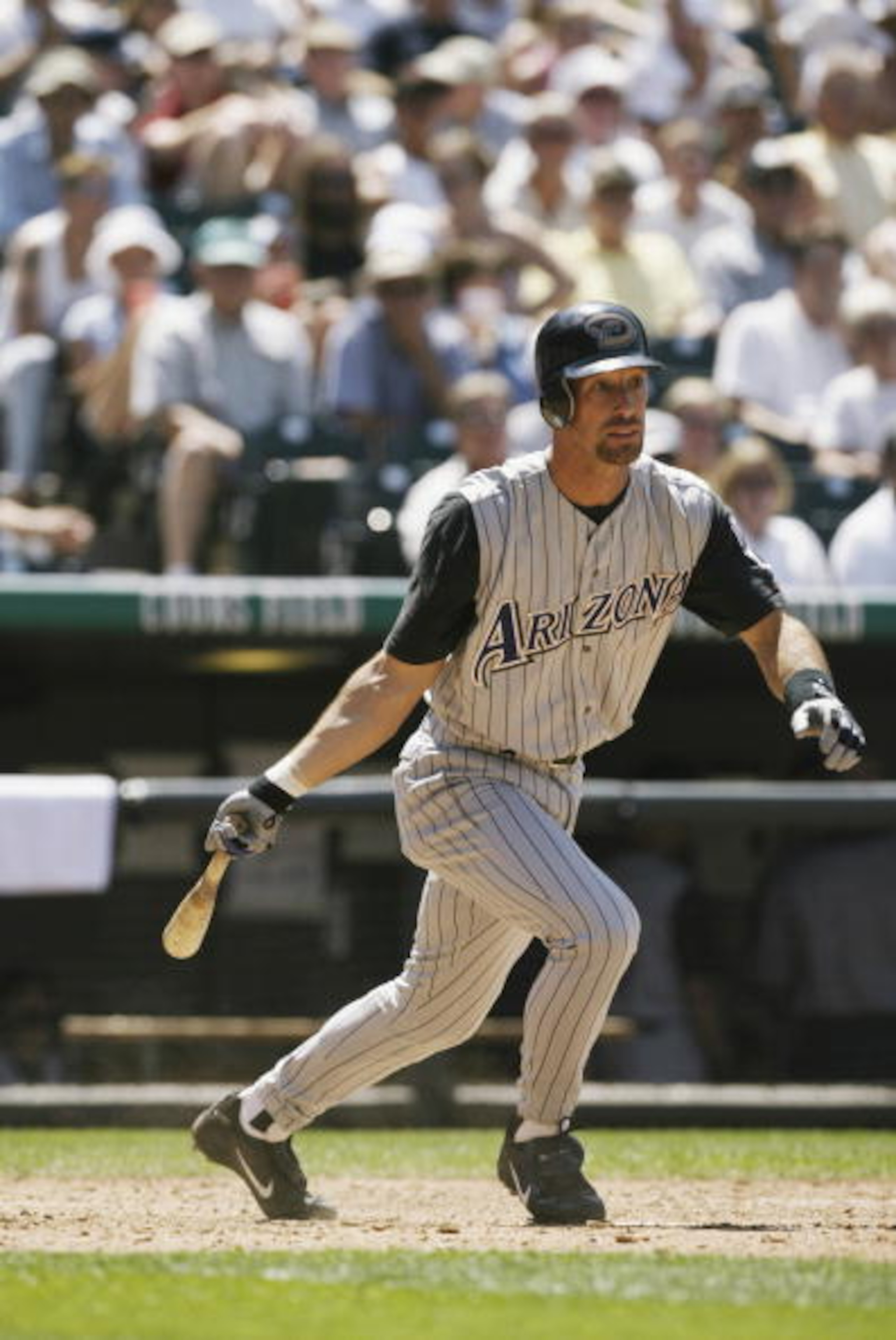 DENVER - JULY 18:  Left fielder Luis Gonzalez #20 of the Arizona Diamondbacks runs out of the batter's box during the MLB game against the Colorado Rockies on July 18, 2002 at Coors Field in Denver, Colorado.  The Rockies won 6-4.  (Photo by Brian Bahr/Ge