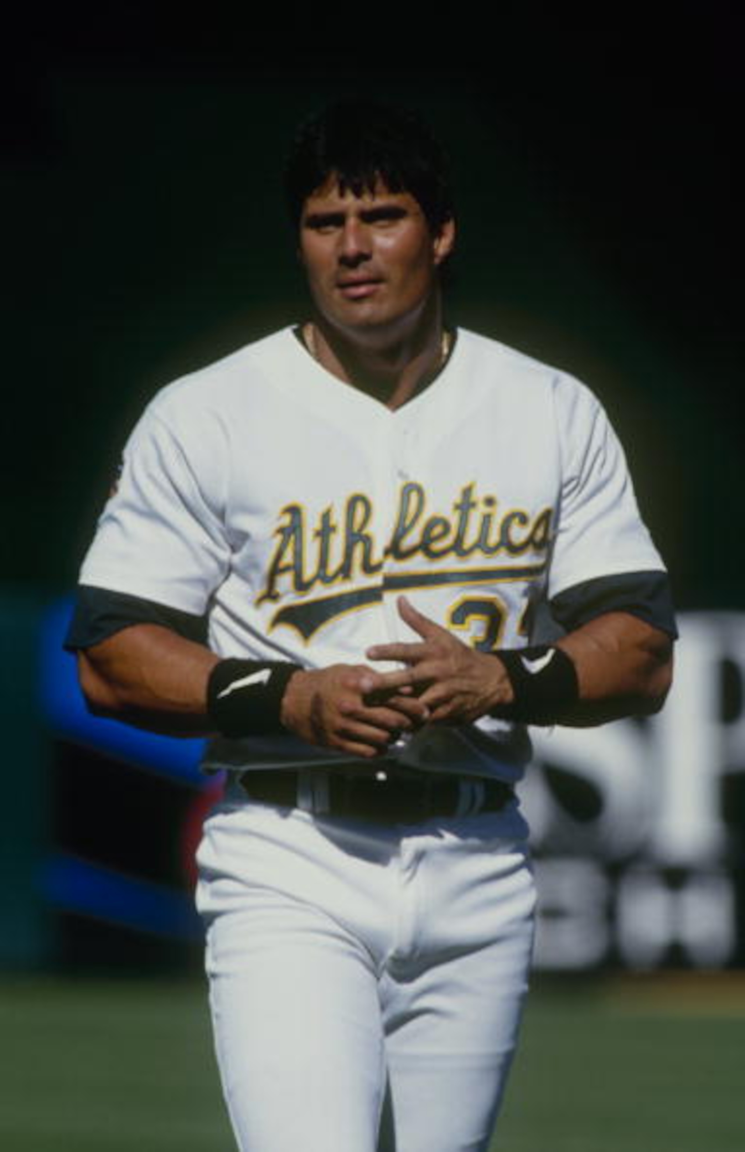 OAKLAND, CA - JUNE 29: Jose Canseco of the Oakland Athletics looks on during the game against the Texas Rangers at Oakland-Alameda County Coliseum on June 29, 1997 in Oakland, California. (Photo by Otto Greule Jr/Getty Images) OAKLAND, CA - JUNE 29: Jose Canseco of the Oakland Athletics looks on during the game against the Texas Rangers at Oakland-Alameda County Coliseum on June 29, 1997 in Oakland, California. (Photo by Otto Greule Jr/Getty Images)