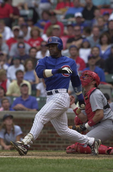 CHICAGO - AUGUST 25:  Rightfielder Sammy Sosa #21 of the Chicago Cubs swings the bat against the St. Louis Cardinals on August 25, 2001 at Wrigley Field in Chicago, Illinois.  The Cubs defeated the Cardinals 6-4.  (Photo by Jonathan Daniel/Getty Images)