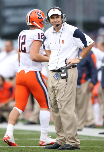 SEATTLE - SEPTEMBER 11:  Head coach Doug Marrone of the Syracuse Orange looks on as quarterback Ryan Nassib #12 comes off the field during the game against the Washington Huskies on September 11, 2010 at Husky Stadium in Seattle, Washington. (Photo by Ott