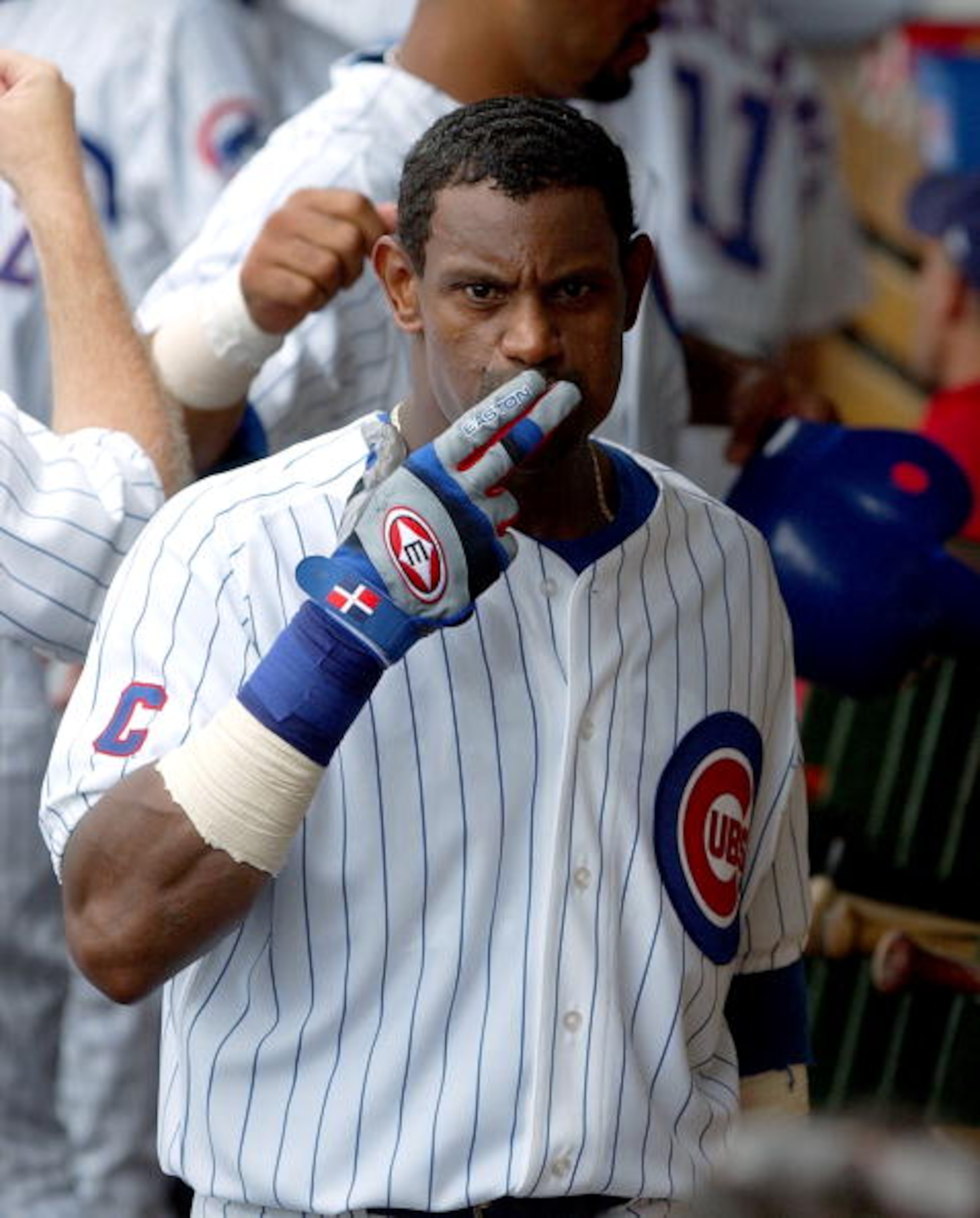 CHICAGO - AUGUST 26: Sammy Sosa #21 of the Chicago Cubs blows kisses in the dugout after hitting a three-run home run in the third inning against the Houston Astros on August 26, 2004 at Wrigley Field in Chicago, Illinois. The Cubs defeated the Astros 8- CHICAGO - AUGUST 26: Sammy Sosa #21 of the Chicago Cubs blows kisses in the dugout after hitting a three-run home run in the third inning against the Houston Astros on August 26, 2004 at Wrigley Field in Chicago, Illinois. The Cubs defeated the Astros 8-
