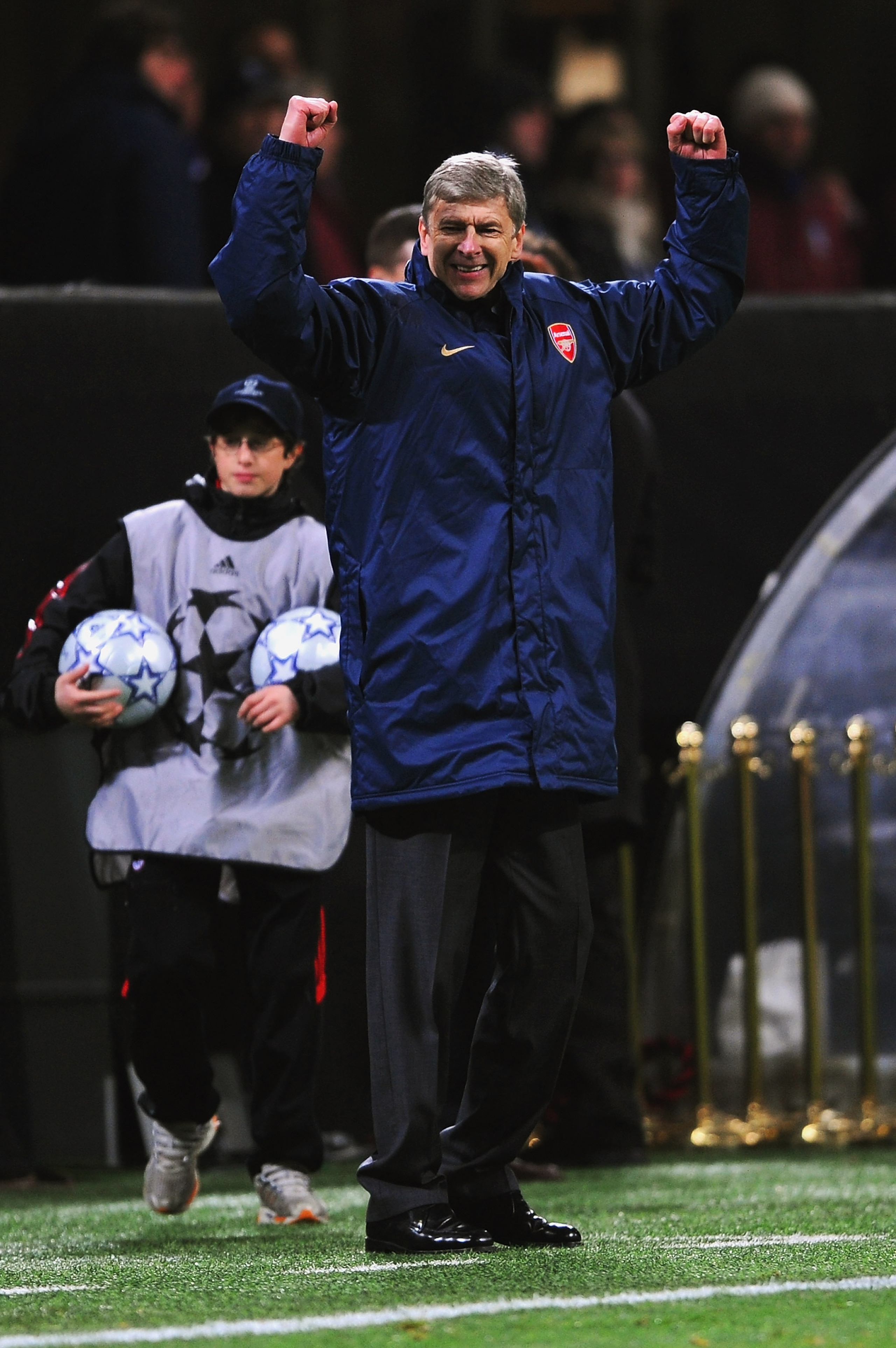 MILAN, ITALY - MARCH 04: Arsene Wenger, manager of Arsenal celebrates his teams win after the UEFA Champions League 1st knockout round 2nd leg match between AC Milan and Arsenal at the San Siro stadium on March 4, 2008 in Milan, Italy.  (Photo by Shaun Bo