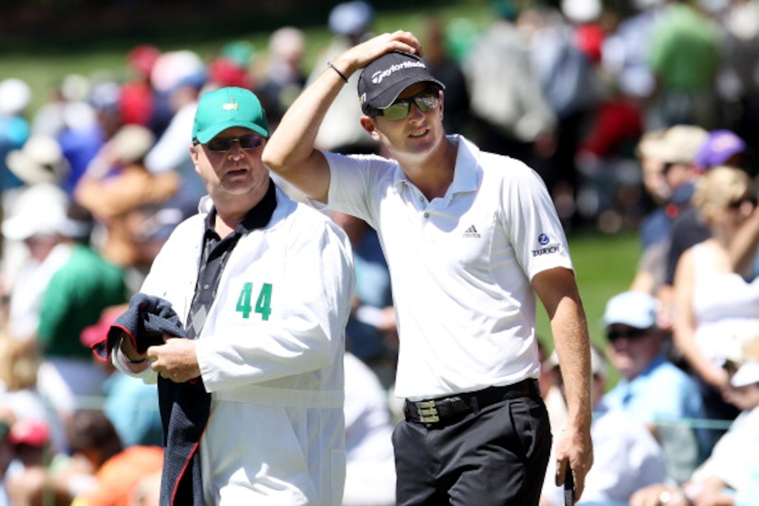 AUGUSTA, GA - APRIL 06:  Justin Rose of England looks on with his caddie during the Par 3 Contest prior to the 2011 Masters Tournament at Augusta National Golf Club on April 6, 2011 in Augusta, Georgia.  (Photo by Andrew Redington/Getty Images)