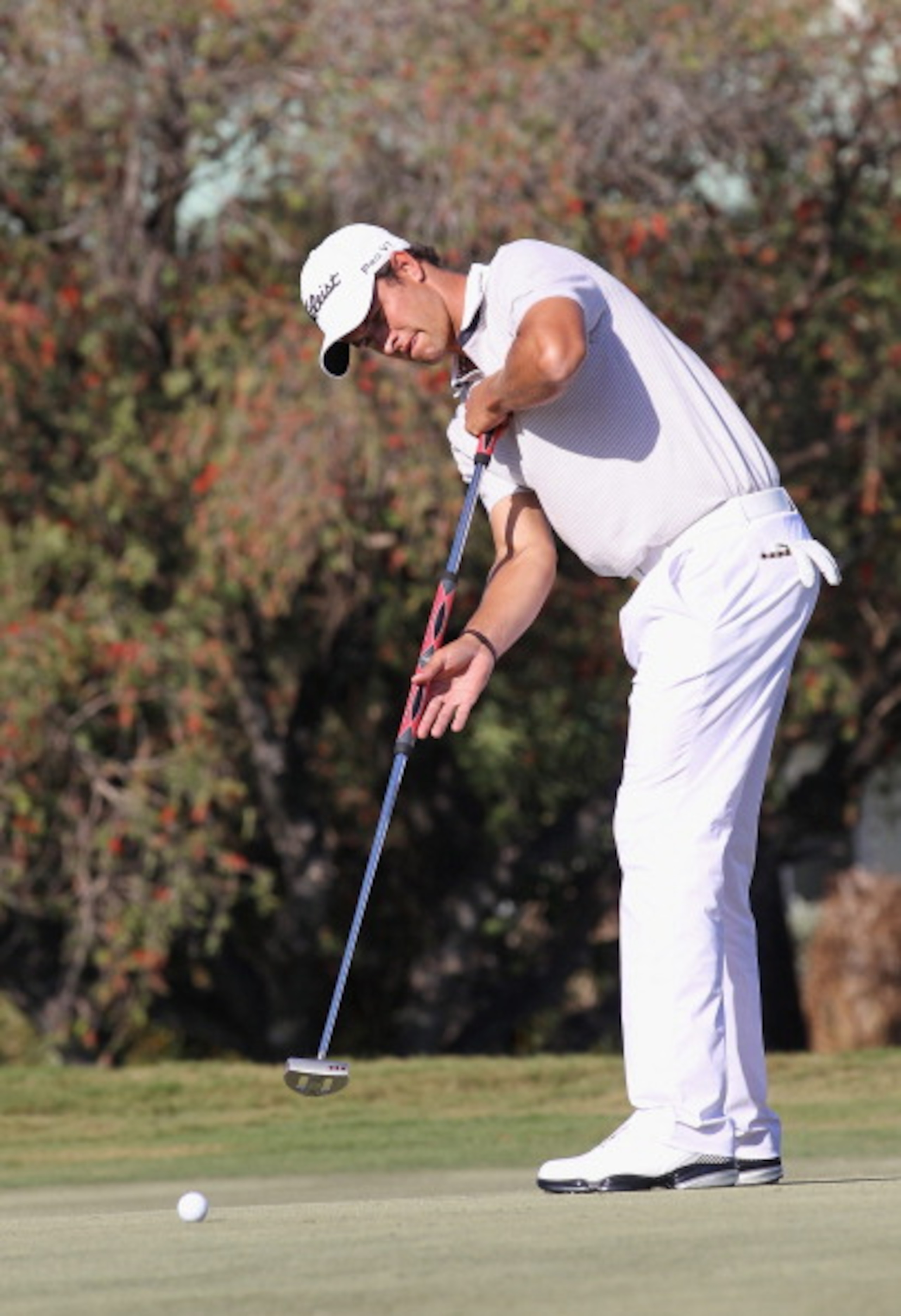 DORAL, FL - MARCH 13:  Adam Scott of Australia hits a putt during the final round of the 2011 WGC- Cadillac Championship at the TPC Blue Monster at the Doral Golf Resort and Spa on March 13, 2011 in Doral, Florida.  (Photo by Sam Greenwood/Getty Images)