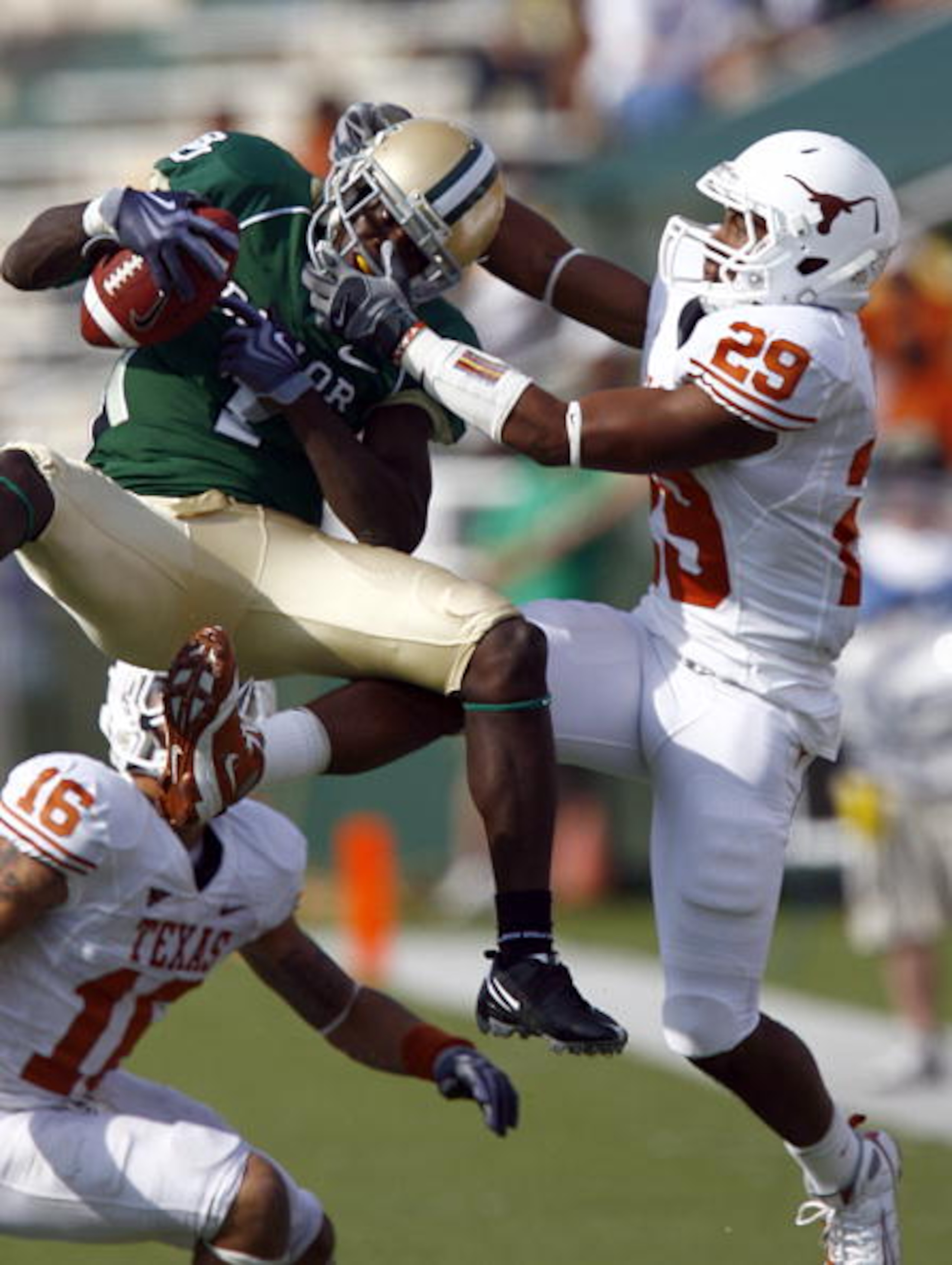 WACO, TX - NOVEMBER 14:  Inside receiver Kendall Wright #1 for the Baylor Bears pull in a pass against defensive back Clark Ford #29 for the Texas Longhorns in the second half on November 14, 2009 at Floyd Casey Stadium in Waco, Texas.  The Longhorns beat