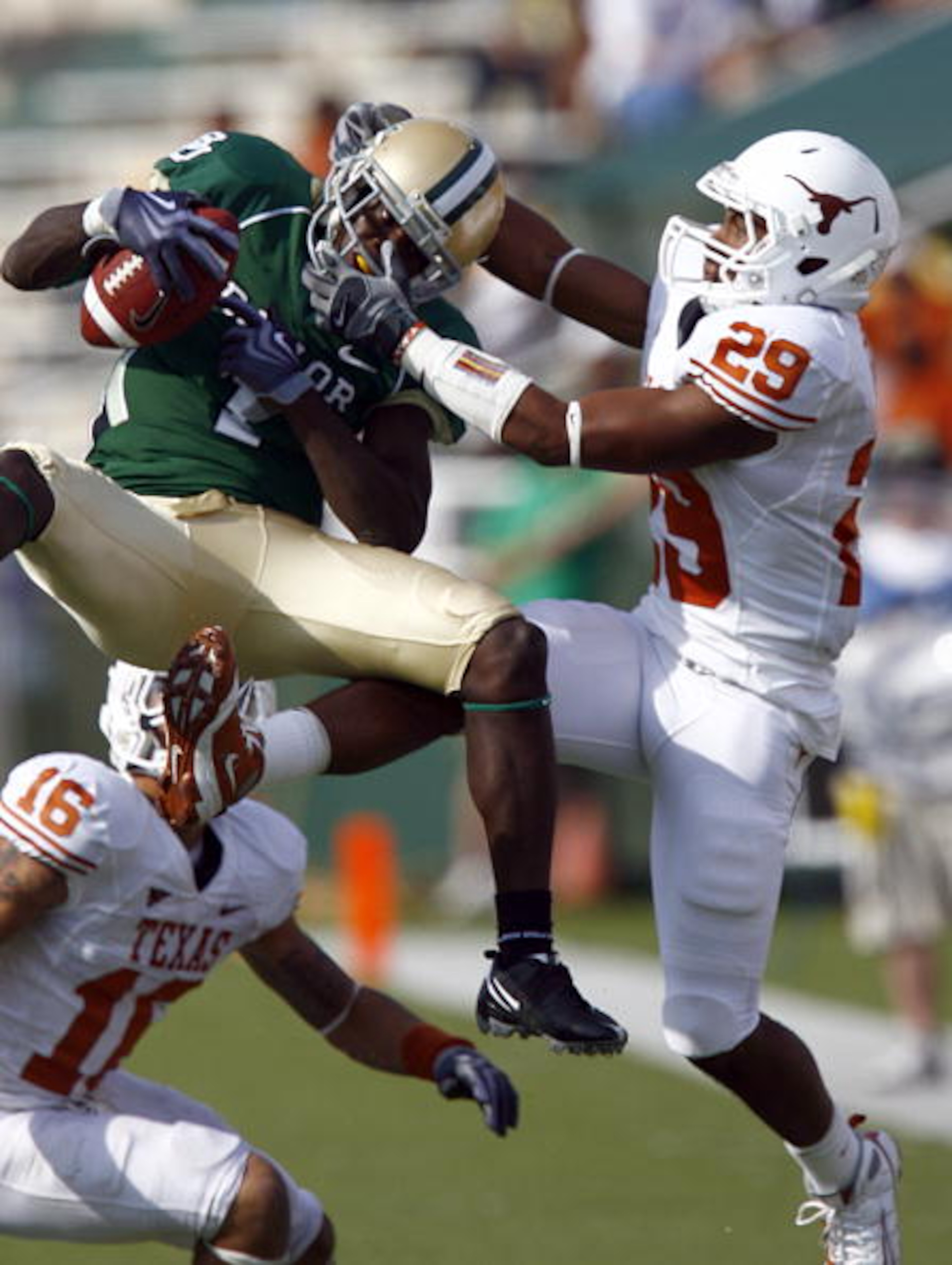 WACO, TX - NOVEMBER 14:  Inside receiver Kendall Wright #1 for the Baylor Bears pull in a pass against defensive back Clark Ford #29 for the Texas Longhorns in the second half on November 14, 2009 at Floyd Casey Stadium in Waco, Texas.  The Longhorns beat