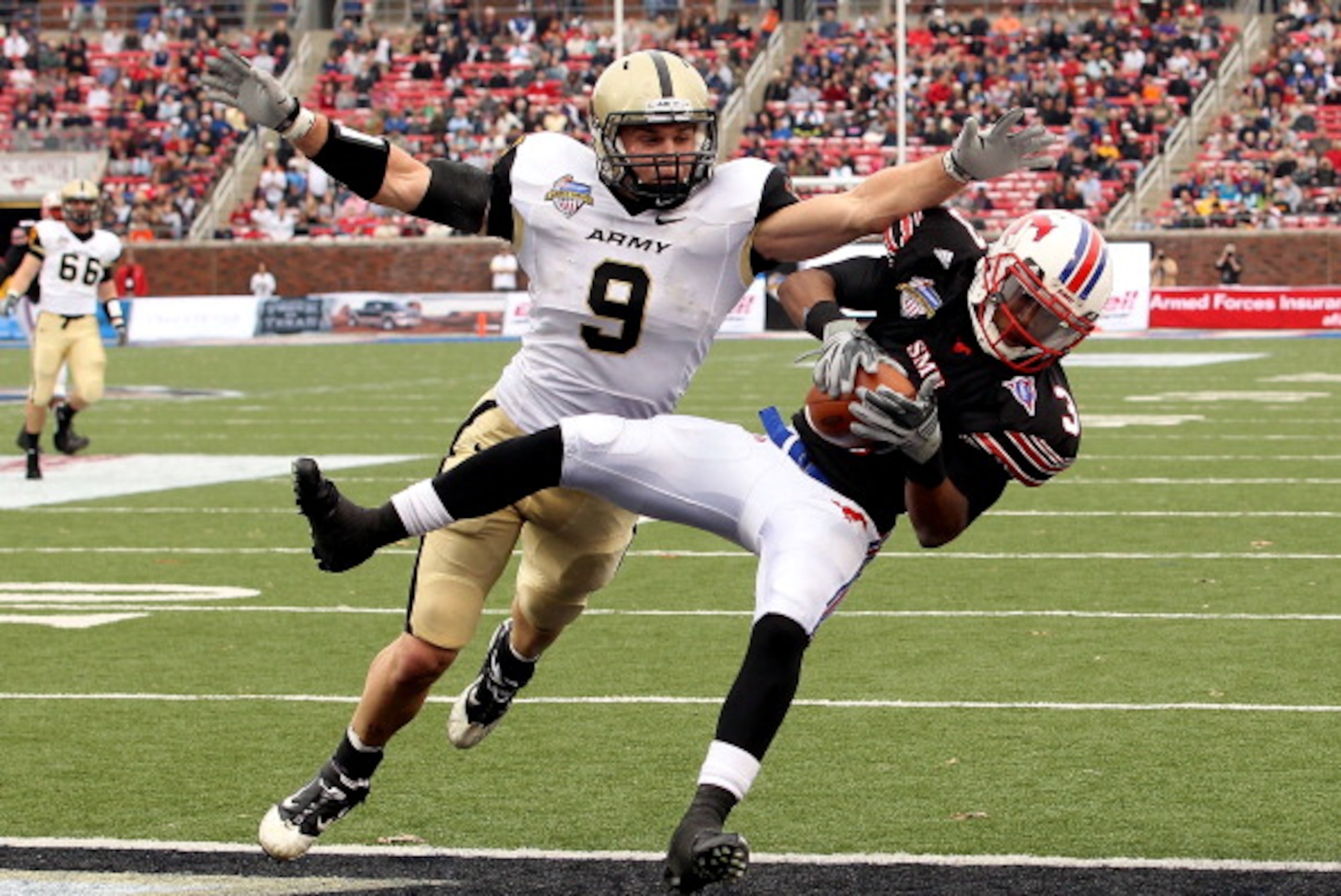 DALLAS, TX - DECEMBER 30:  Wide receiver Darius Johnson #3 of the SMU Mustangs makes a touchdown pass against Steven Erzinger #9 of the Army Black Knights during the Bell Helicopter Armed Forces Bowl at Gerald J. Ford Stadium on December 30, 2010 in Dalla