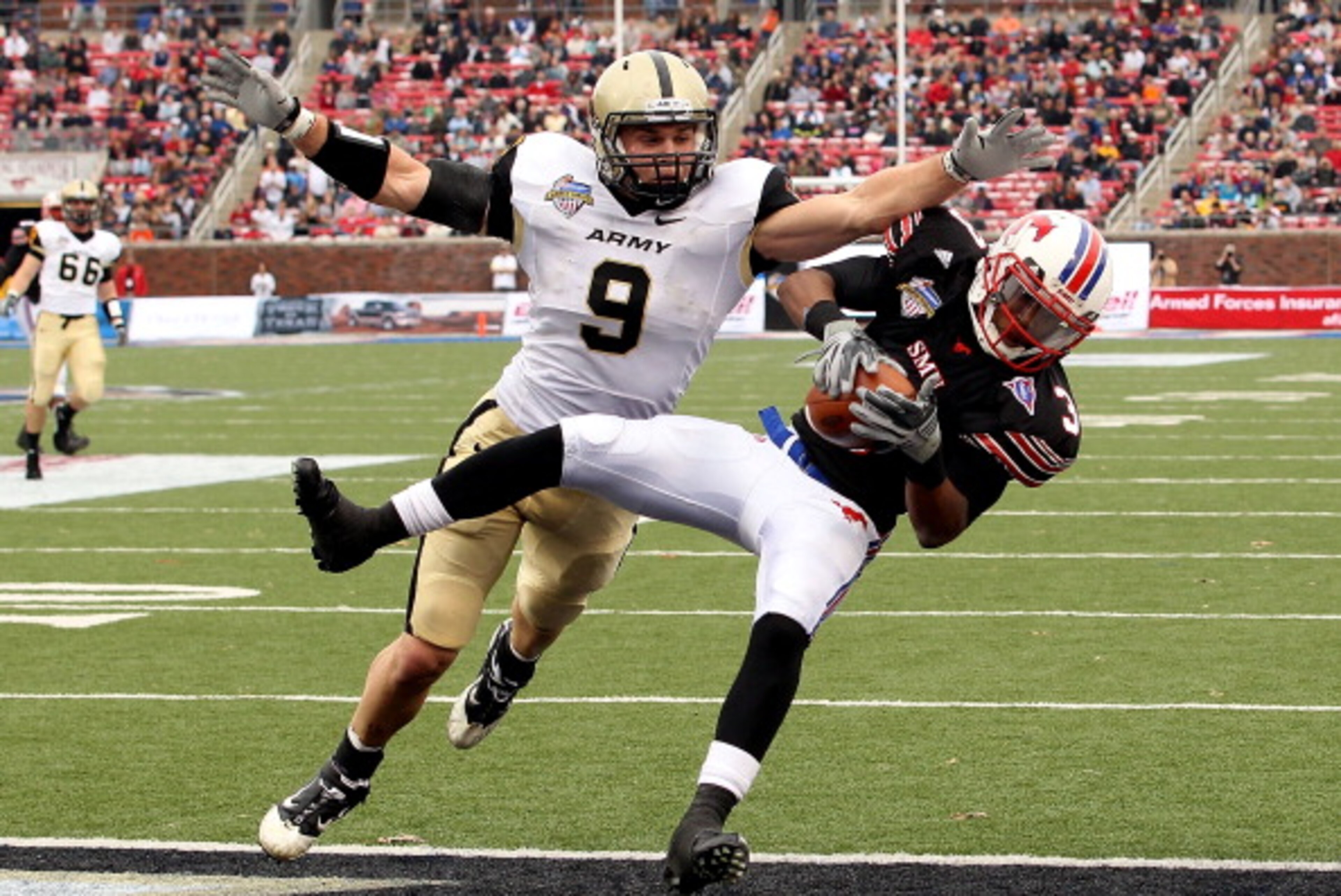 DALLAS, TX - DECEMBER 30:  Wide receiver Darius Johnson #3 of the SMU Mustangs makes a touchdown pass against Steven Erzinger #9 of the Army Black Knights during the Bell Helicopter Armed Forces Bowl at Gerald J. Ford Stadium on December 30, 2010 in Dalla