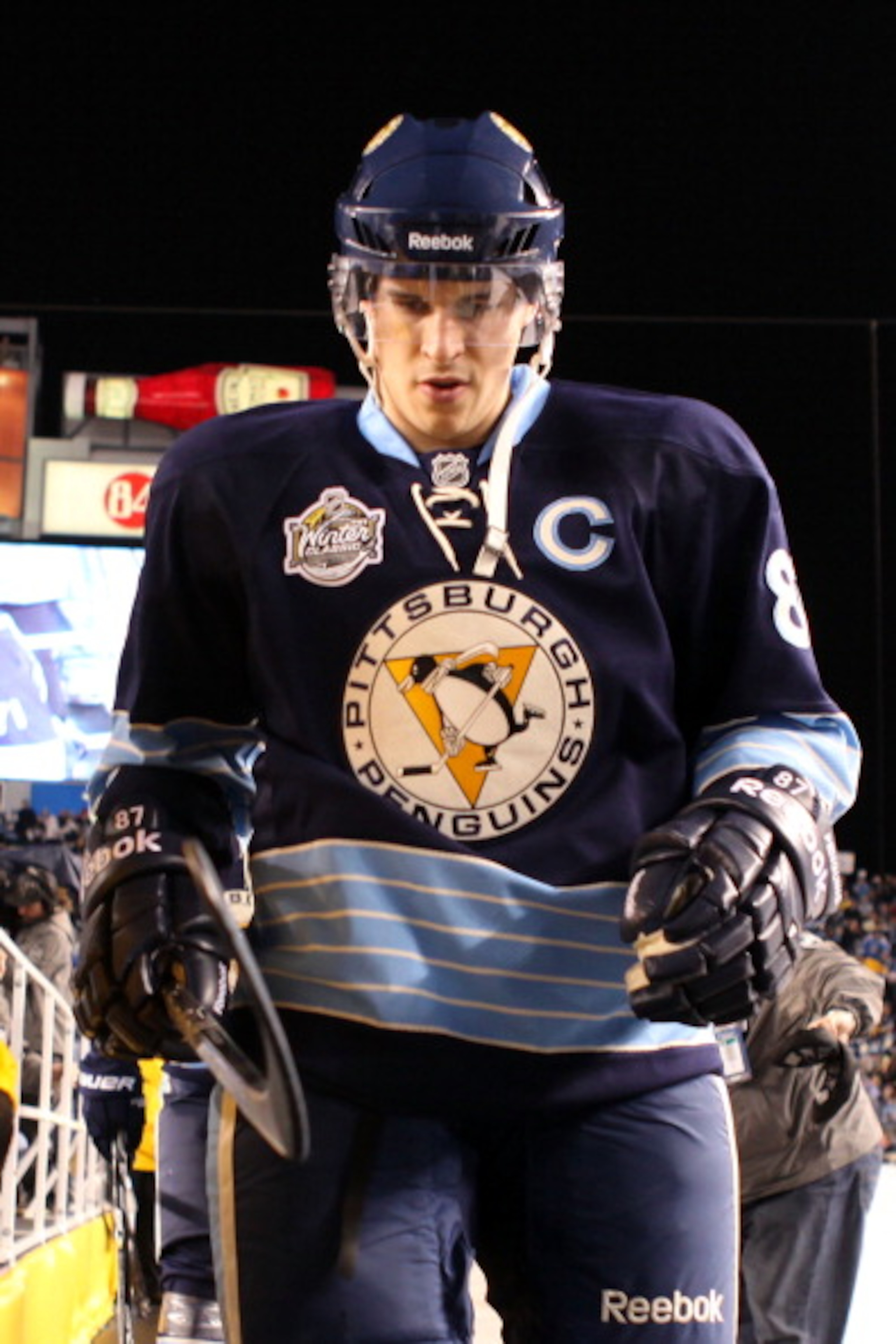 PITTSBURGH, PA - JANUARY 01:  Captain Sidney Crosby #87 of the Pittsburgh Penguins walks out to the ice before playing against the Washington Capitals during the 2011 NHL Bridgestone Winter Classic at Heinz Field on January 1, 2011 in Pittsburgh, Pennsylv