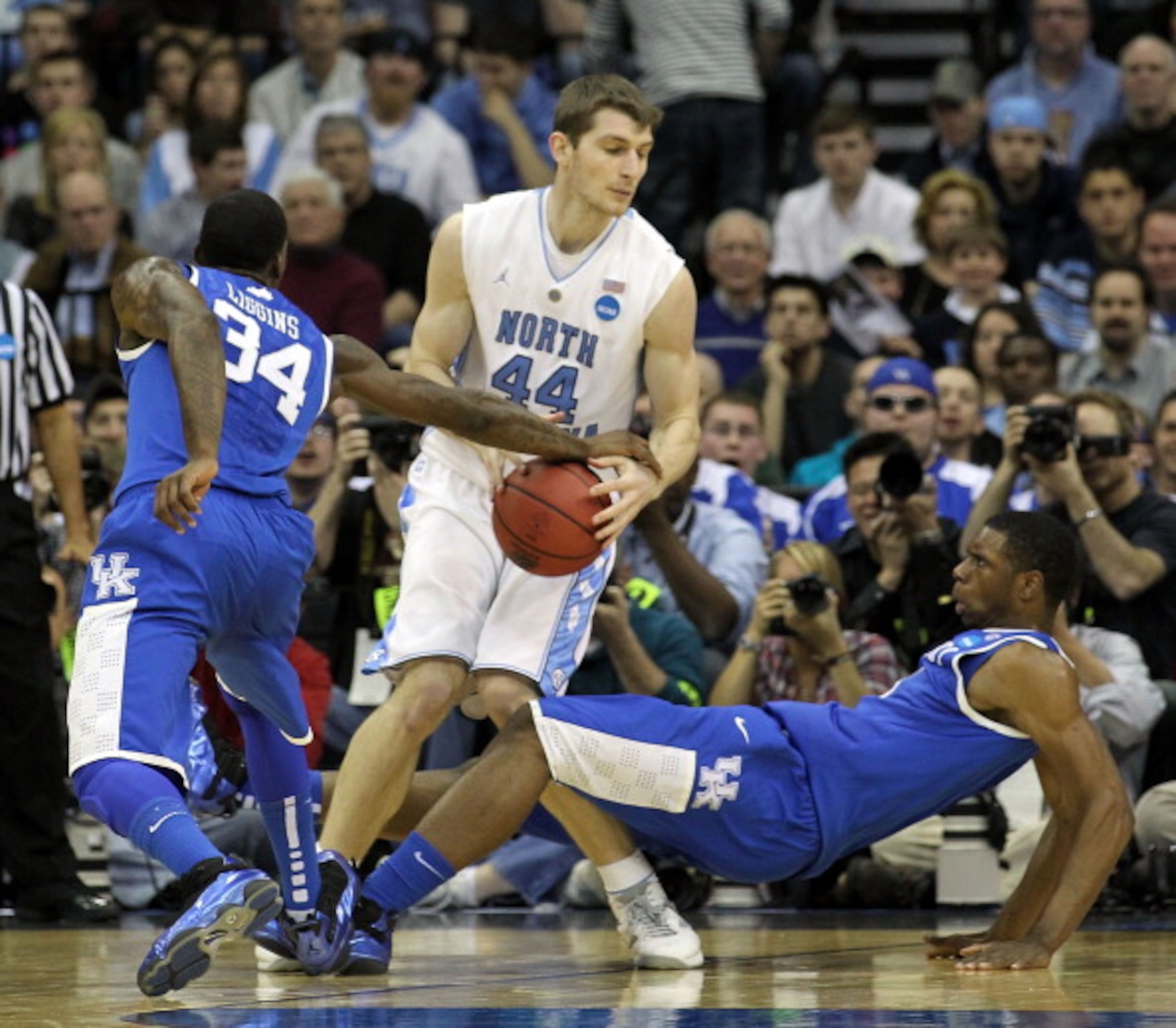 NEWARK, NJ - MARCH 27:  Tyler Zeller #44 of the North Carolina Tar Heels in action against DeAndre Liggins #34 and Terrence Jones #3 of the Kentucky Wildcats during the east regional final of the 2011 NCAA men's basketball tournament at Prudential Center 