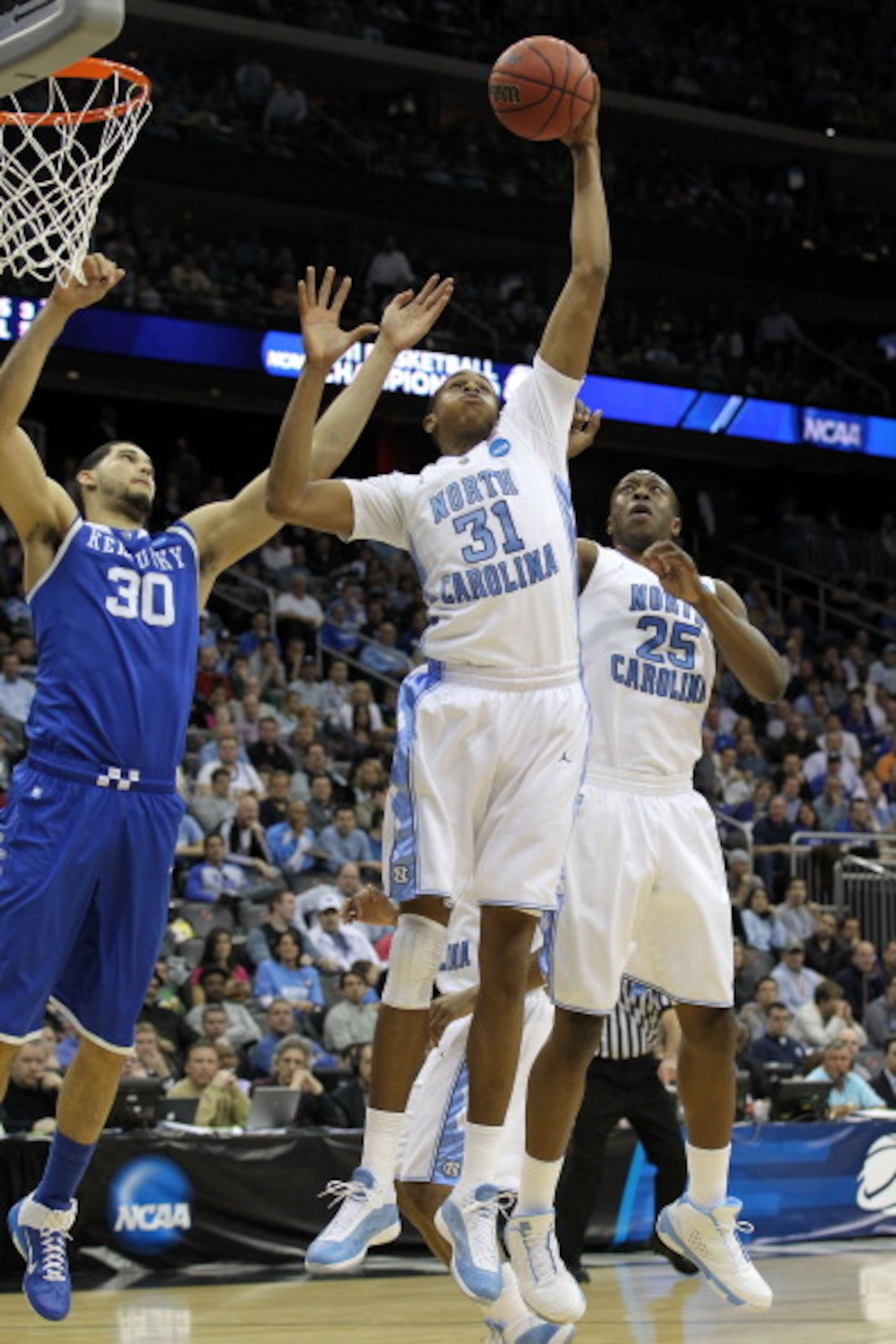 NEWARK, NJ - MARCH 27:  John Henson #31 of the North Carolina Tar Heels in action against Eloy Vargas #30 of the Kentucky Wildcats during the east regional final of the 2011 NCAA men's basketball tournament at Prudential Center on March 27, 2011 in Newark
