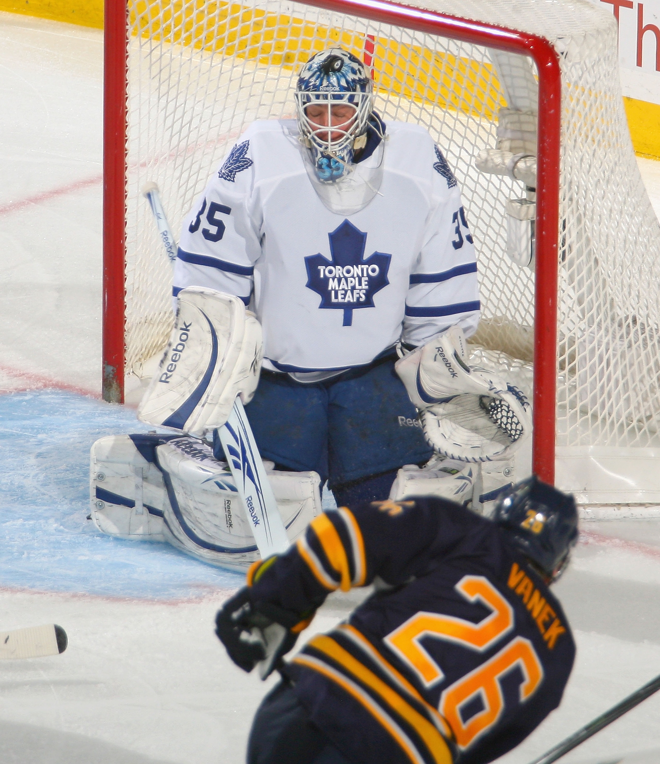 BUFFALO, NY - FEBRUARY 16: Jean-Sebastien Giguere #35 of the Toronto Maple Leafs makes a save on a shot by Thomas Vanek #26 of the Buffalo Sabres  at HSBC Arena on February 16, 2011 in Buffalo, New York.  (Photo by Rick Stewart/Getty Images)