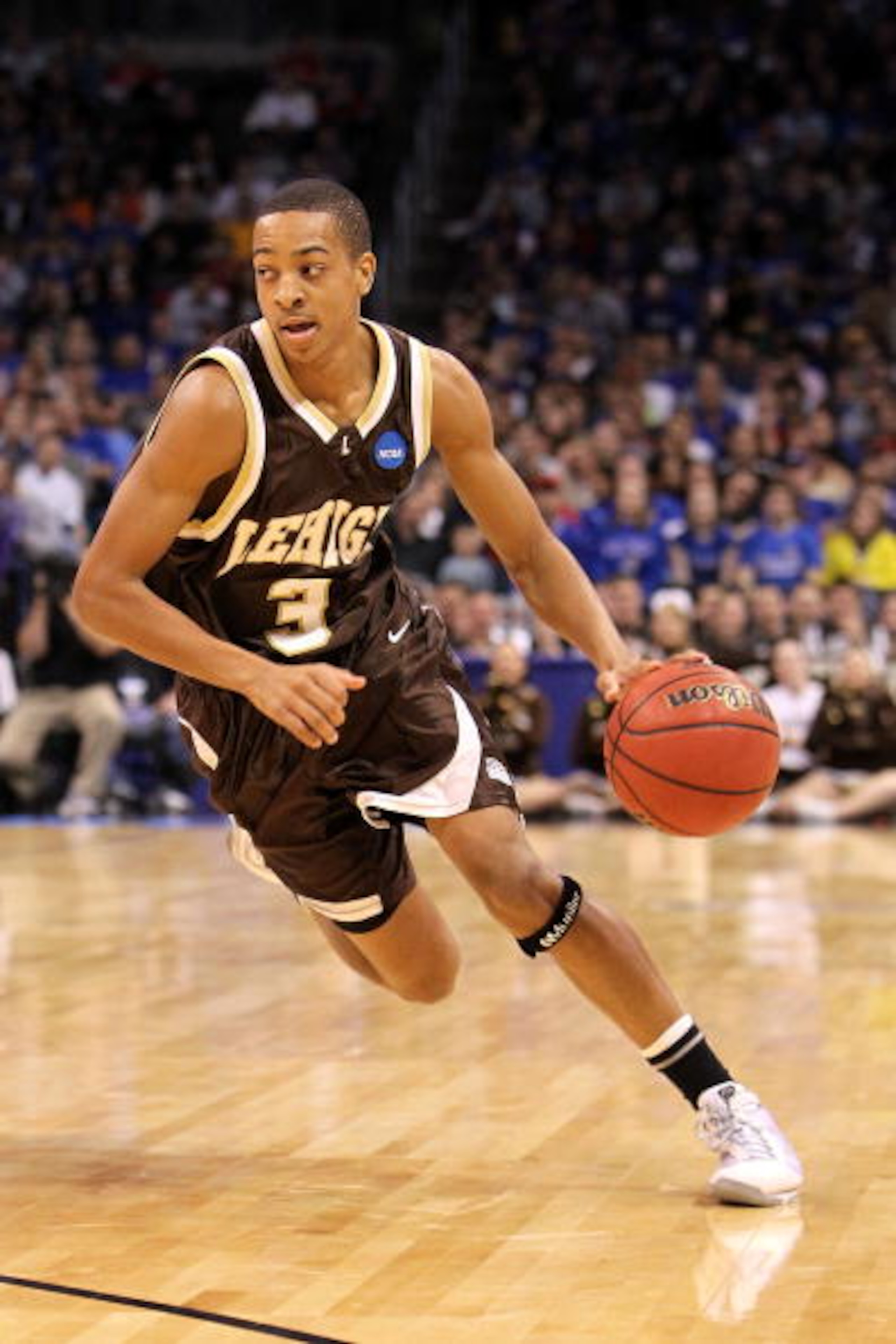 OKLAHOMA CITY - MARCH 18:  CJ McCollum #3 of the Lehigh Mountain Hawks drives against the Kansas Jayhawks during the first round of the 2010 NCAA men's basketball tournament at Ford Center on March 18, 2010 in Oklahoma City, Oklahoma.  (Photo by Ronald Ma