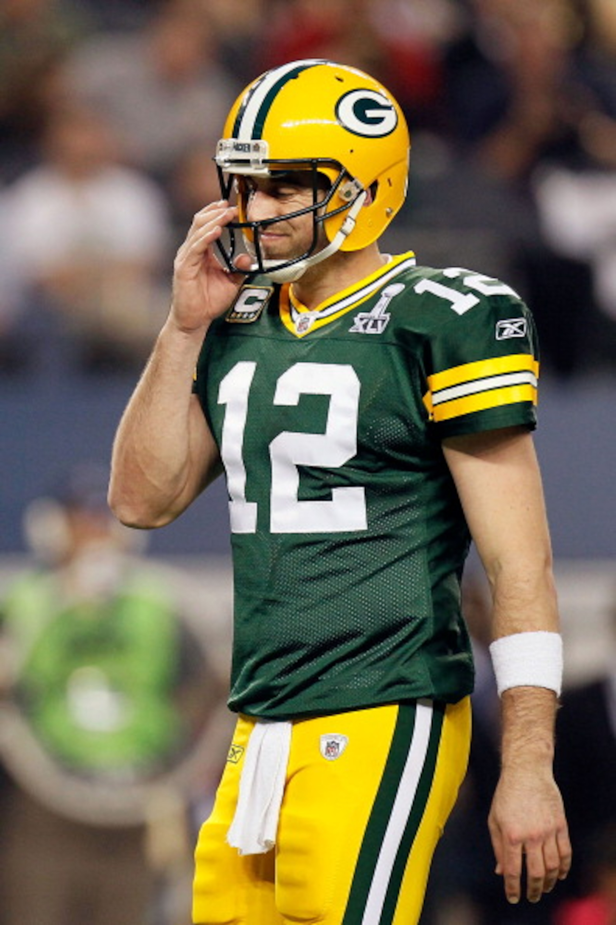 ARLINGTON, TX - FEBRUARY 06:  Aaron Rodgers #12 of the Green Bay Packers looks on after a play against the Pittsburgh Steelers during the second half of Super Bowl XLV at Cowboys Stadium on February 6, 2011 in Arlington, Texas.  (Photo by Kevin C. Cox/Get