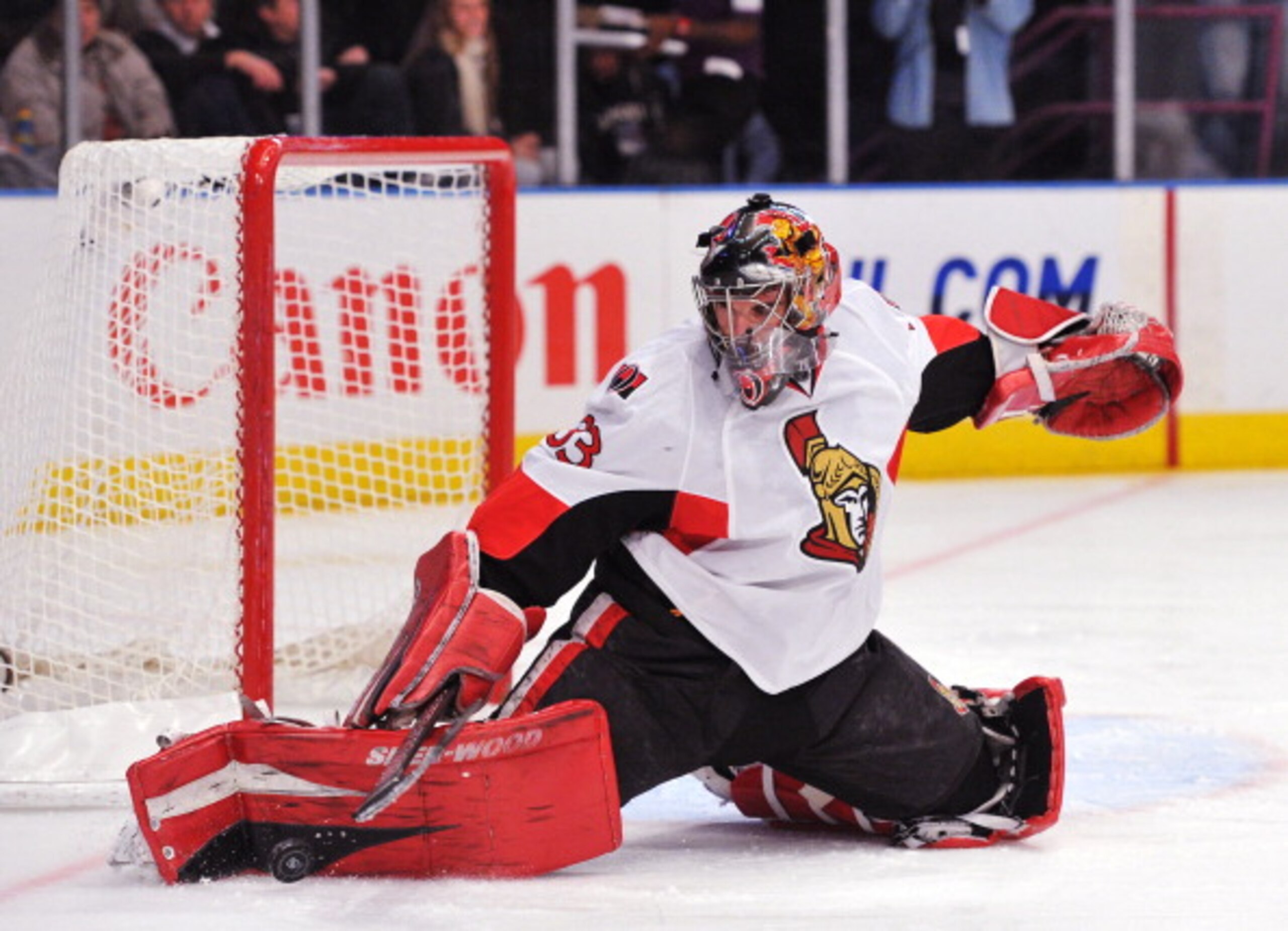 NEW YORK, NY - DECEMBER 5: Pascal Leclaire #33 of the Ottawa Senators deflects a shot on goal during the second period against the New York Rangers at Madison Square Garden on December 5, 2010 in New York City. (Photo by Christopher Pasatieri/Getty Images