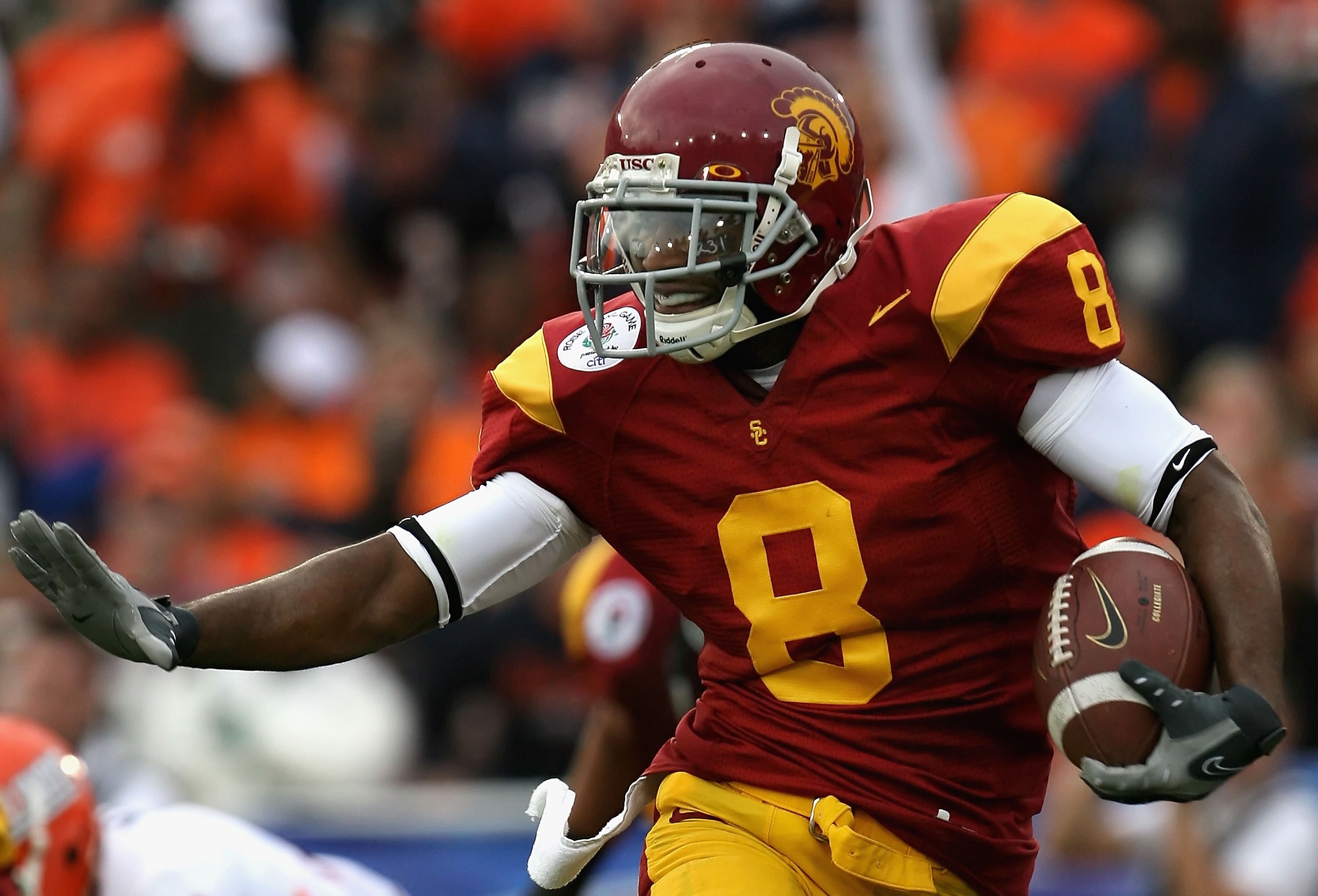 PASADENA, CA - JANUARY 01:  Wide receiver Ronald Johnson #8 of the USC Trojans runs with the ball against the Illinois Fighting Illini during the Rose Bowl presented by Citi at the Rose Bowl on January 1, 2008 in Pasadena, California.  The Trojans defeate