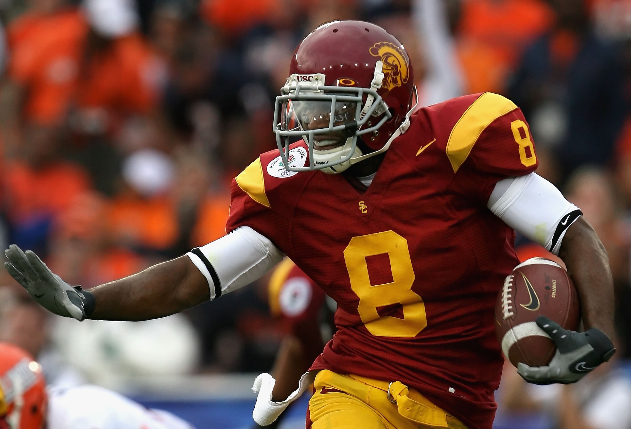 PASADENA, CA - JANUARY 01:  Wide receiver Ronald Johnson #8 of the USC Trojans runs with the ball against the Illinois Fighting Illini during the Rose Bowl presented by Citi at the Rose Bowl on January 1, 2008 in Pasadena, California.  The Trojans defeate