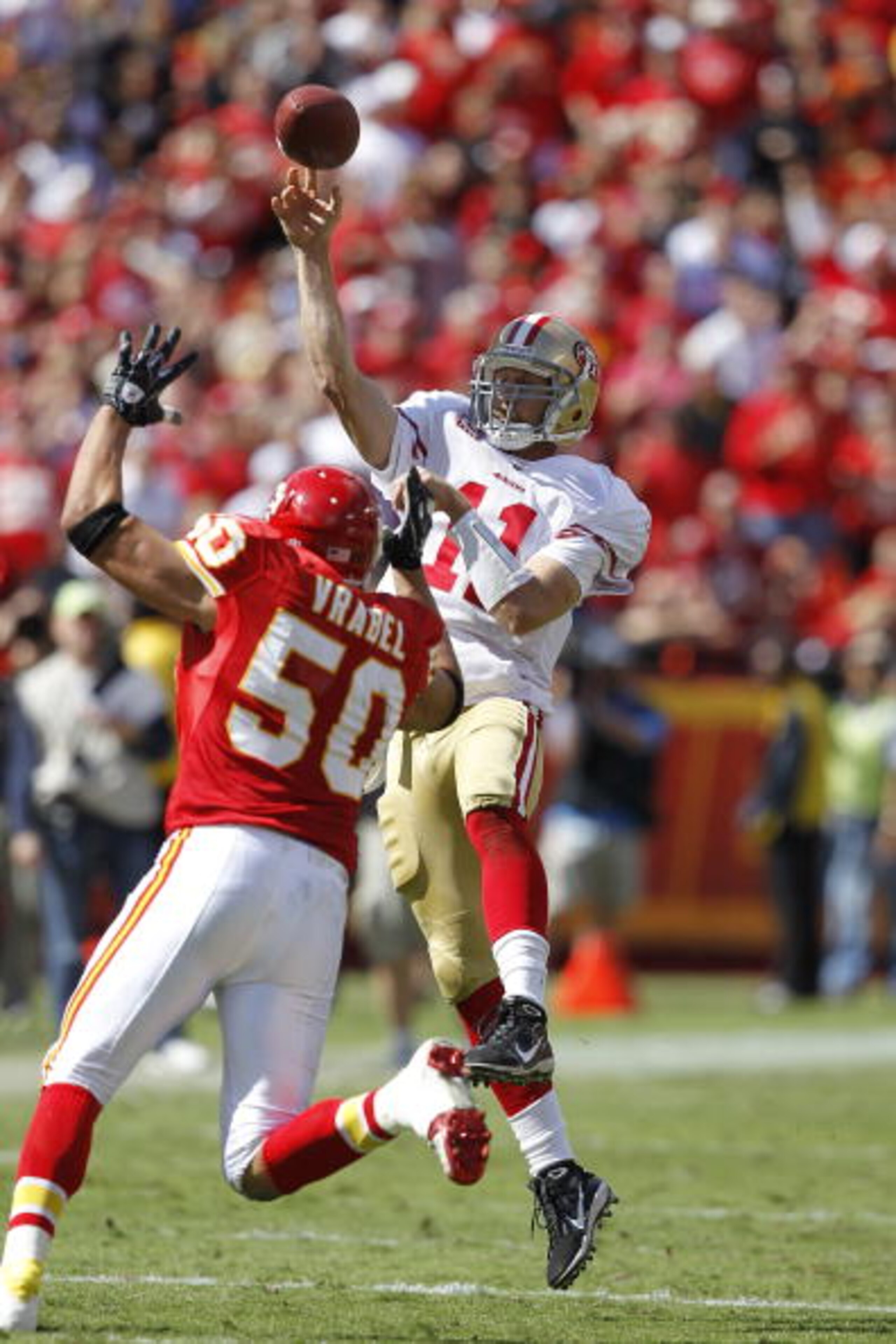 KANSAS CITY, MO - SEPTEMBER 26: Alex Smith #11 of the San Francisco 49ers passes the ball while under pressure from Mike Vrabel #50 of the Kansas City Chiefs at Arrowhead Stadium on September 26, 2010 in Kansas City, Missouri. The Chiefs won 31-10. (Photo