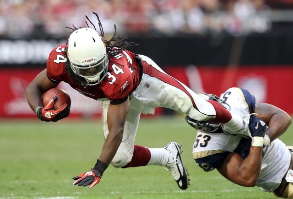 GLENDALE, AZ - DECEMBER 05:  Runningback Tim Hightower #34 of the Arizona Cardinals is tackled by Na'il Diggs #53 of the St. Louis Rams during the NFL game at the University of Phoenix Stadium on December 5, 2010 in Glendale, Arizona.  The Rams defeated t