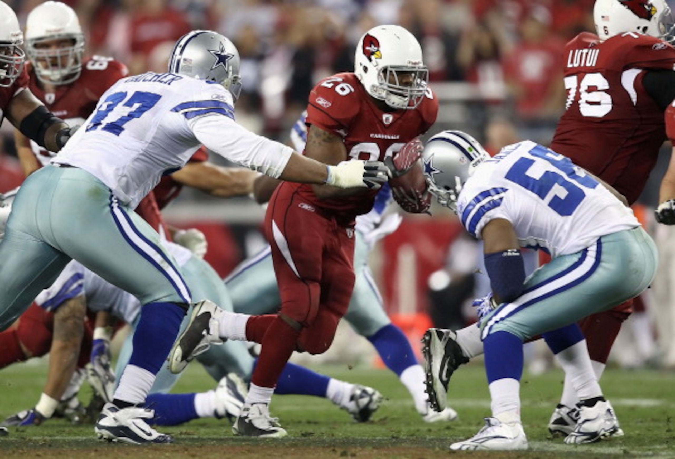 GLENDALE, AZ - DECEMBER 25:  Runningback Beanie Wells #26 of the Arizona Cardinals rushes the football against the Dallas Cowboys during the NFL game at the University of Phoenix Stadium on December 25, 2010 in Glendale, Arizona. The Cardinals defeated th