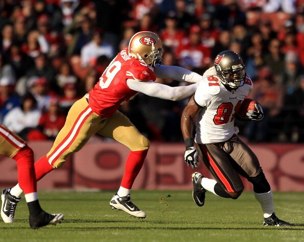 SAN FRANCISCO - NOVEMBER 21:  Micheal Spurlock #81 of the Tampa Bay Buccaneers tries turnover outrun Manny Lawson #99 of the San Francisco 49ers at Candlestick Park on November 21, 2010 in San Francisco, California.  (Photo by Ezra Shaw/Getty Images)