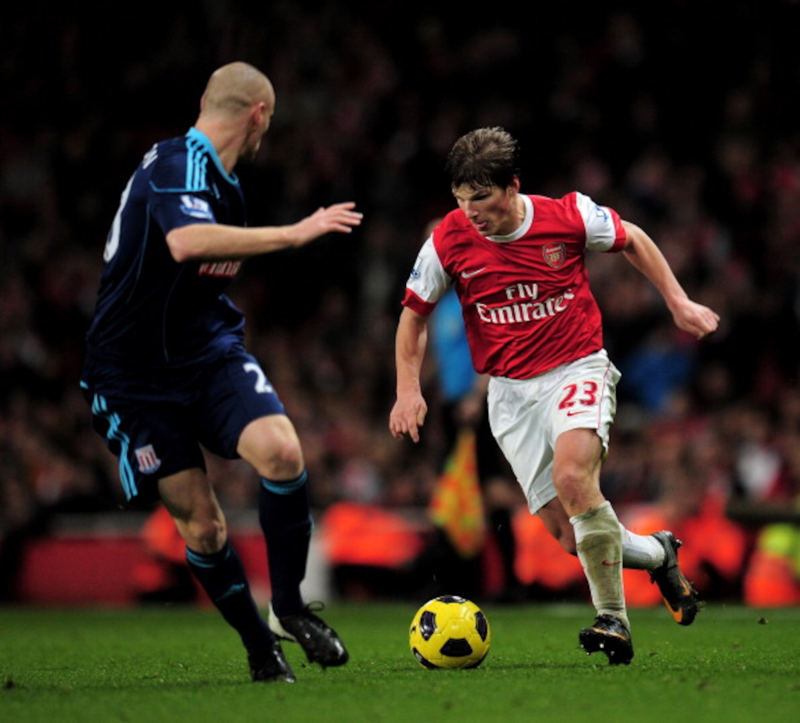 LONDON, ENGLAND - FEBRUARY 23: Andy Wilkinson (L) of Stoke tracks Andrey Arshavin of Arsenal as he runs with the ball during the Barclays Premier League match between Arsenal and Stoke City at the Emirates Stadium on February 23, 2011 in London, England. LONDON, ENGLAND - FEBRUARY 23: Andy Wilkinson (L) of Stoke tracks Andrey Arshavin of Arsenal as he runs with the ball during the Barclays Premier League match between Arsenal and Stoke City at the Emirates Stadium on February 23, 2011 in London, England.