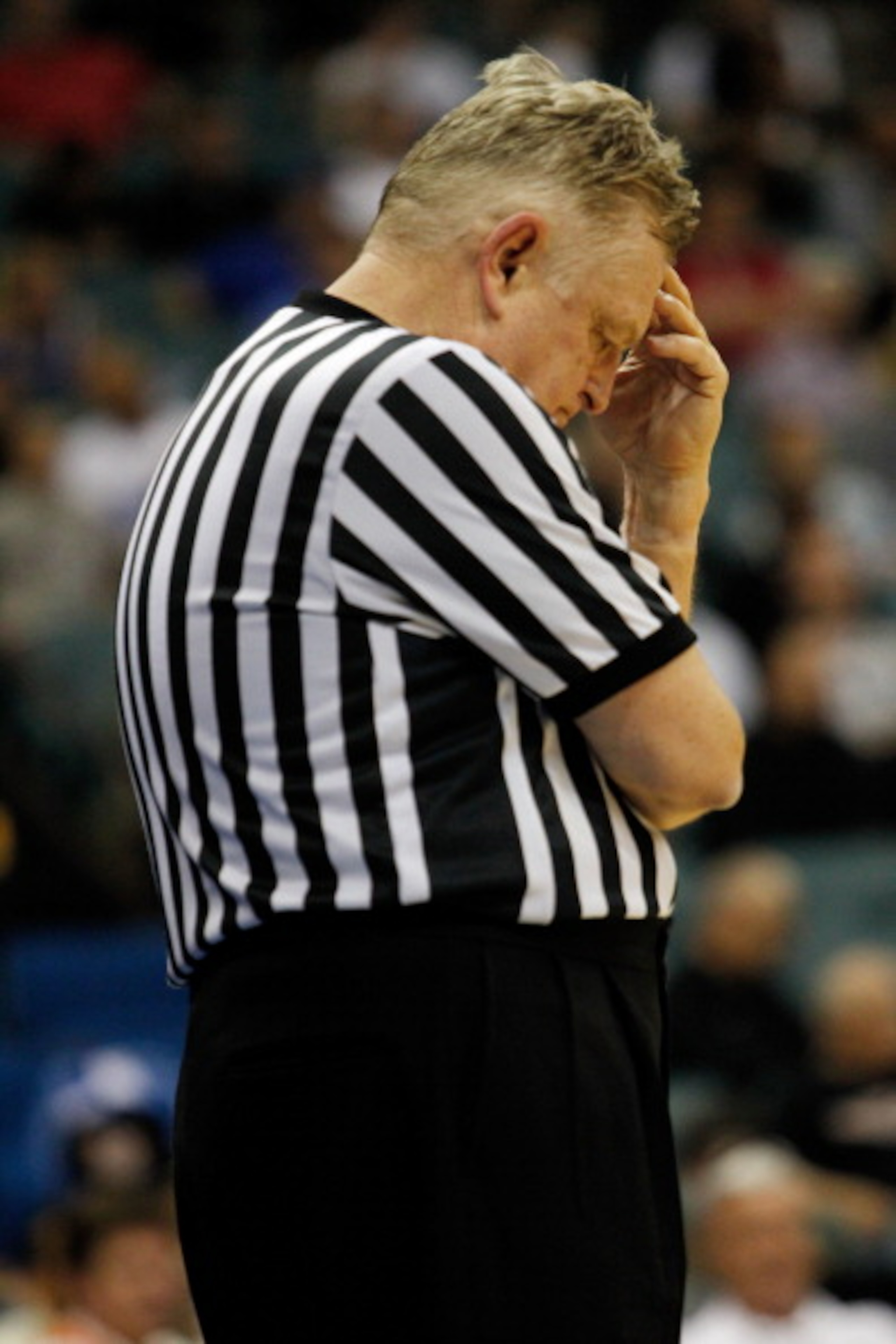 TULSA, OK - MARCH 18:  Referee Jim Burr stands on the court during the second round game between the Memphis Tigers and the Arizona Wildcats in the 2011 NCAA men's basketball tournament at BOK Center on March 18, 2011 in Tulsa, Oklahoma.  (Photo by Tom Pe