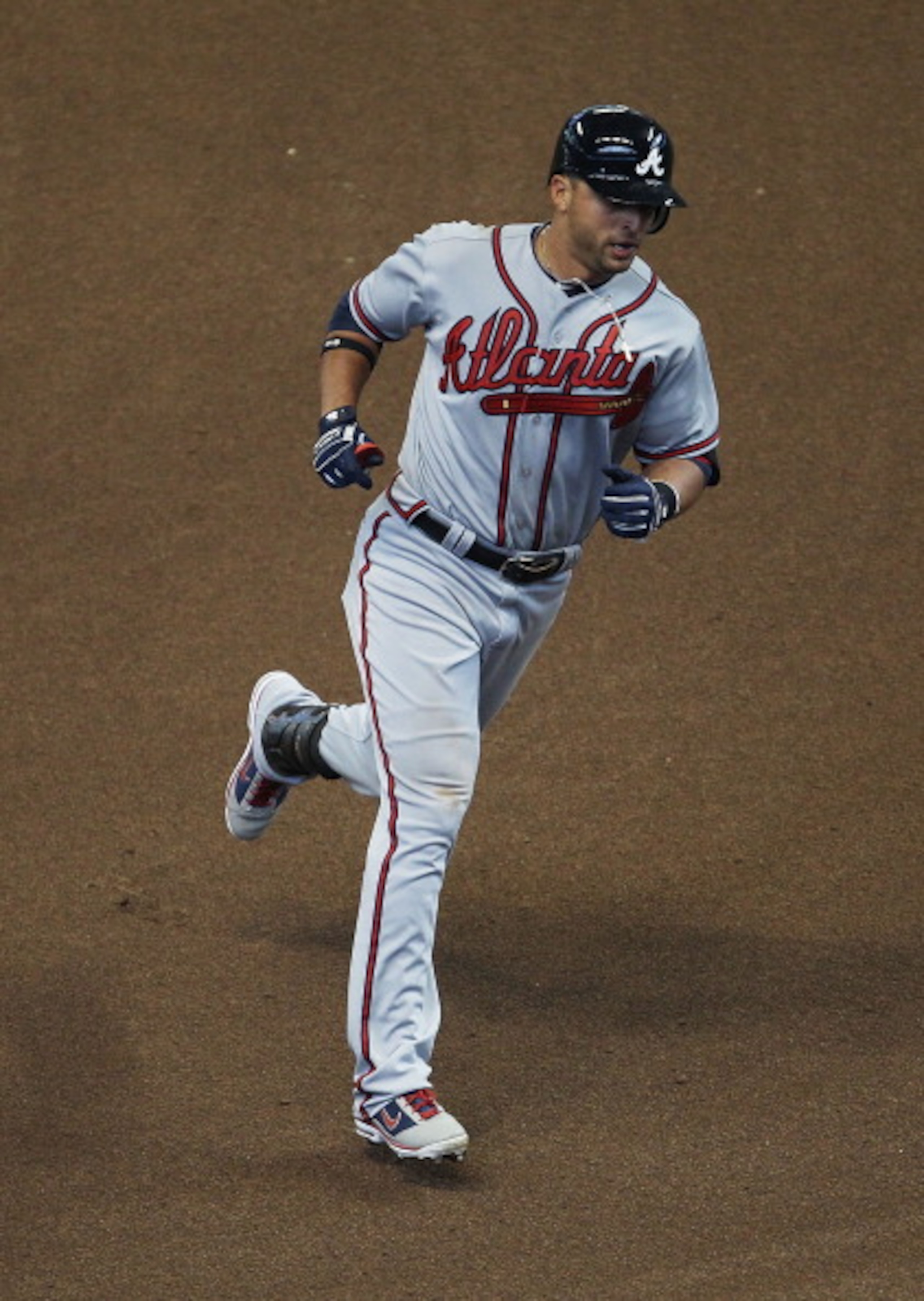 MILWAUKEE, WI - APRIL 04: Martin Prado #14 of the Atlanta Braves runs the bases after hitting a solo home run in the 8th inning against the Milwaukee Brewers during the home opener at Miller Park on April 4, 2011 in Milwaukee, Wisconsin. The Braves defeat