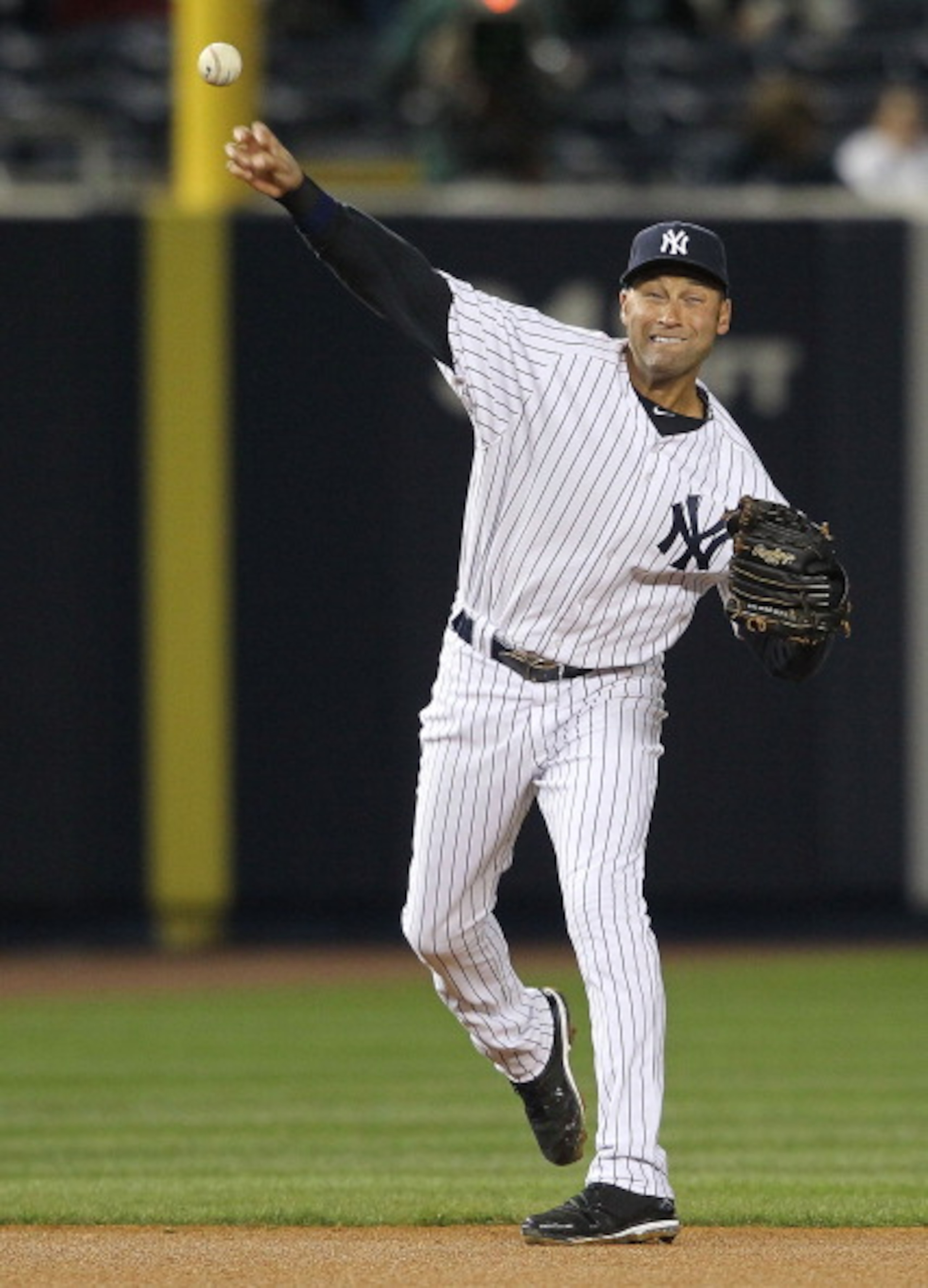 NEW YORK, NY - APRIL 05: Derek Jeter #2 of the New York Yankees throws to first against the Minnesota Twins at Yankee Stadium on April 5, 2011 in the Bronx borough of New York City.  (Photo by Nick Laham/Getty Images)
