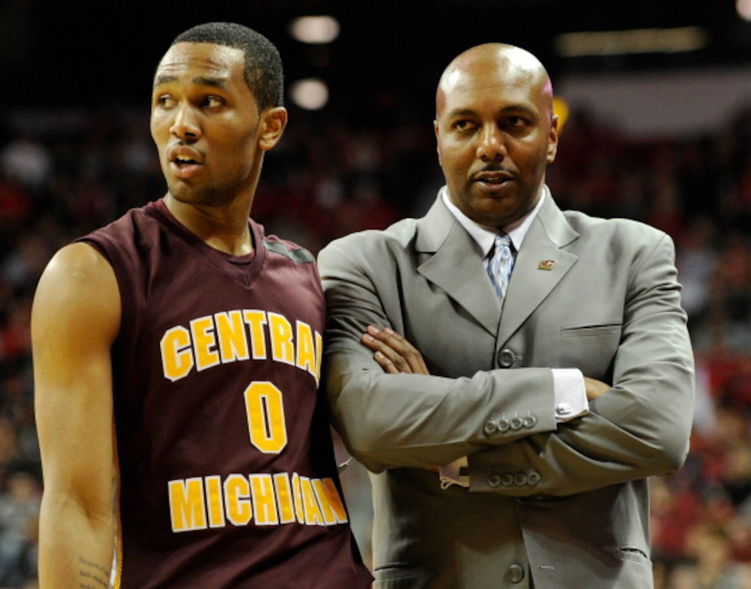 LAS VEGAS, NV - DECEMBER 30:  Trey Zeigler #0 of the Central Michigan Chippewas talks to his father, head coach Ernie Zeigler, during their game against the UNLV Rebels at the Thomas & Mack Center December 30, 2010 in Las Vegas, Nevada. UNLV won 73-47.  (