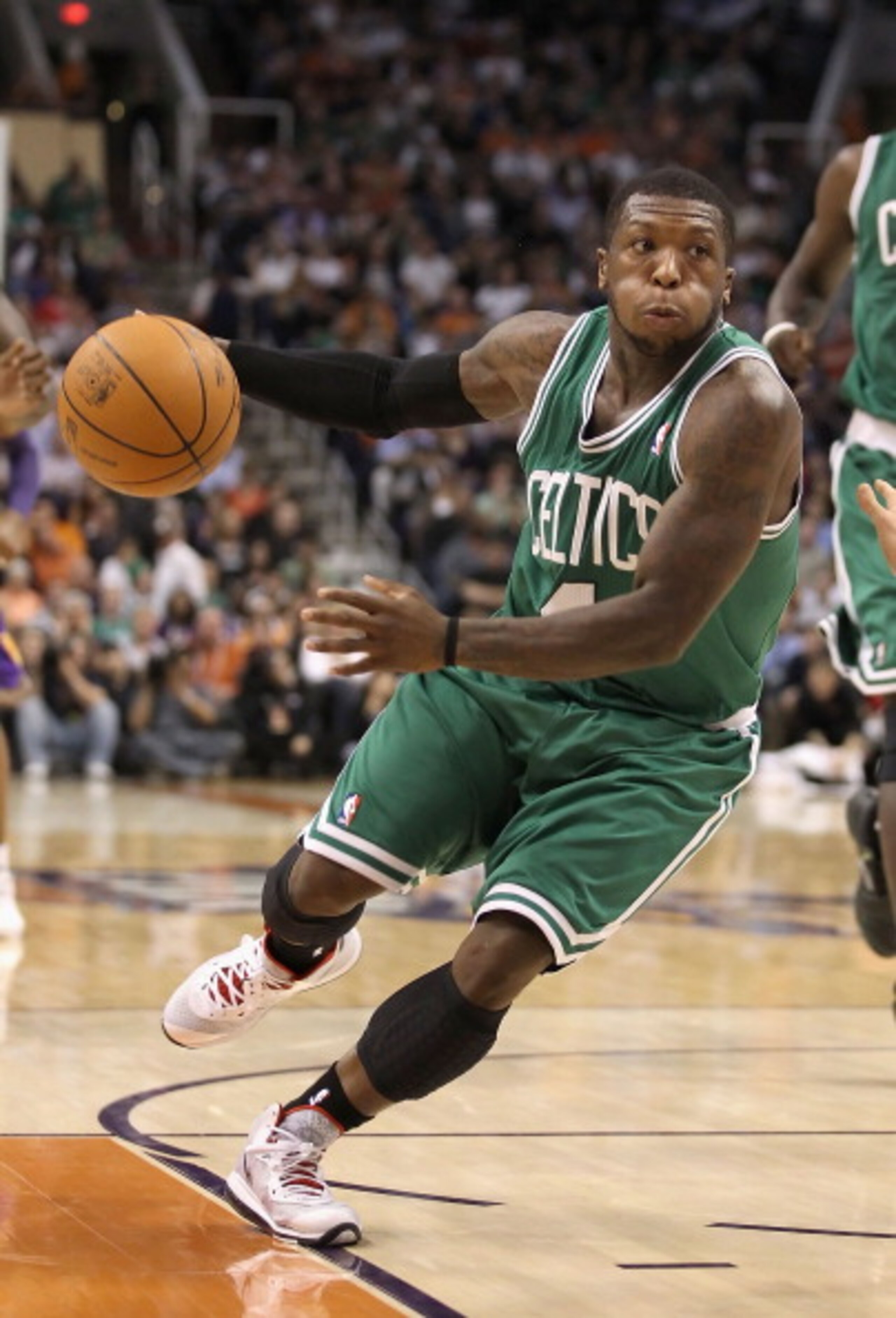 PHOENIX, AZ - JANUARY 28:  Nate Robinson #4 of the Boston Celtics handles the ball during the NBA game against the Phoenix Suns at US Airways Center on January 28, 2011 in Phoenix, Arizona. The Suns defeated the Celtics 88-71. NOTE TO USER: User expressly