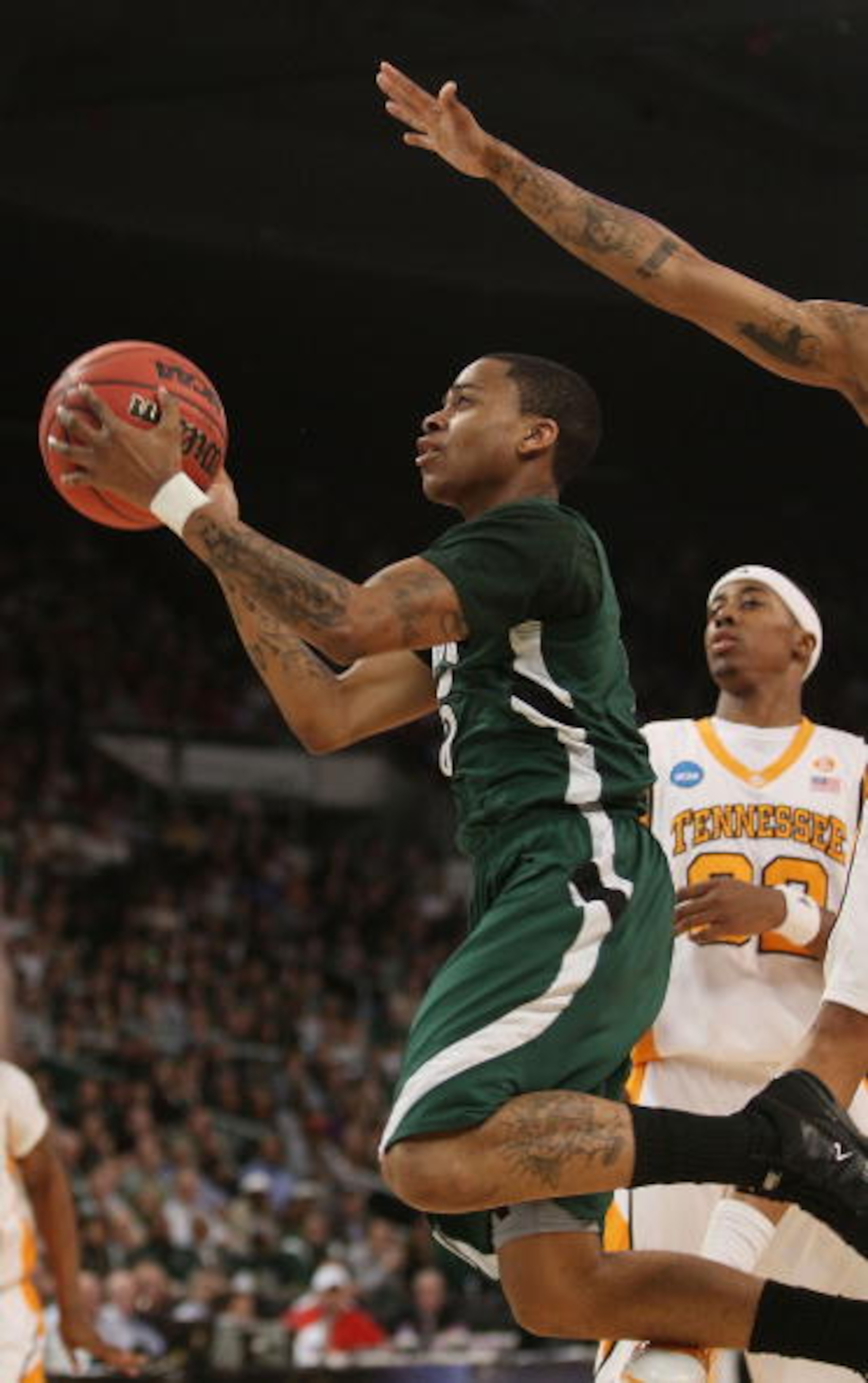 PROVIDENCE, RI - MARCH 20:  D.J. Cooper #5 of the Ohio Bobcats heads for the net as Scotty Hopson #32 of the Tennessee Volunteers defends during the second round of the 2010 NCAA men's basketball tournament on March 20, 2010 at the Dunkin Donuts Center in