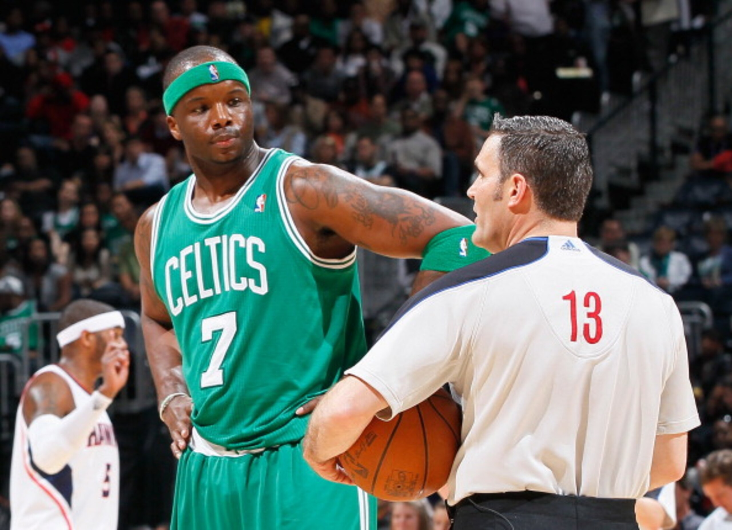 ATLANTA, GA - APRIL 01:  Jermaine O'Neal #7 of the Boston Celtics converses with referee Monty McCutchen #13 against the Atlanta Hawks at Philips Arena on April 1, 2011 in Atlanta, Georgia.  NOTE TO USER: User expressly acknowledges and agrees that, by do