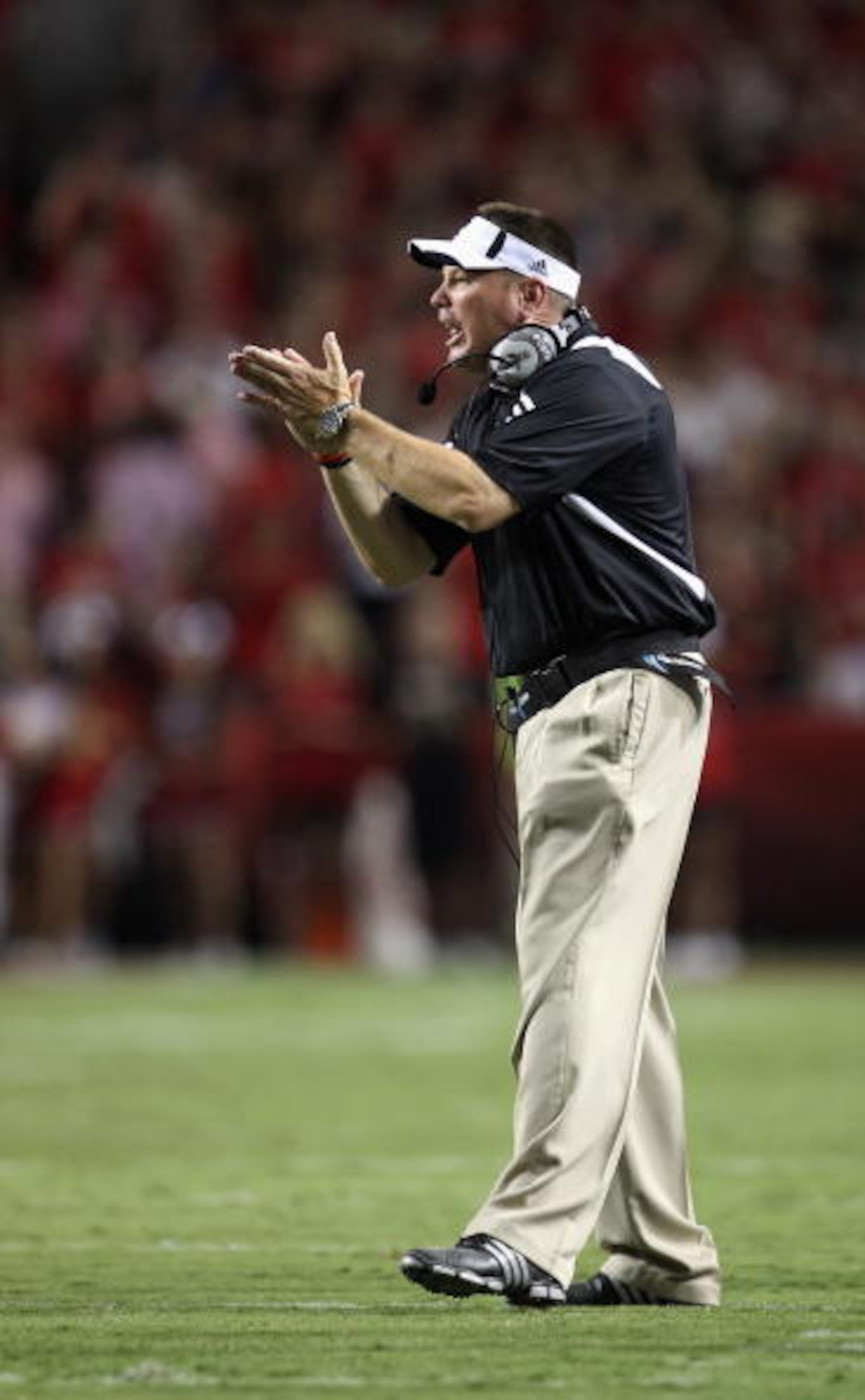 RALEIGH, NC - SEPTEMBER 16:  Head coach Butch Jones of the Cincinnati Bearcats yells at his team against the North Carolina State Wolfpack during their game at Carter-Finley Stadium on September 16, 2010 in Raleigh, North Carolina.  (Photo by Streeter Lec