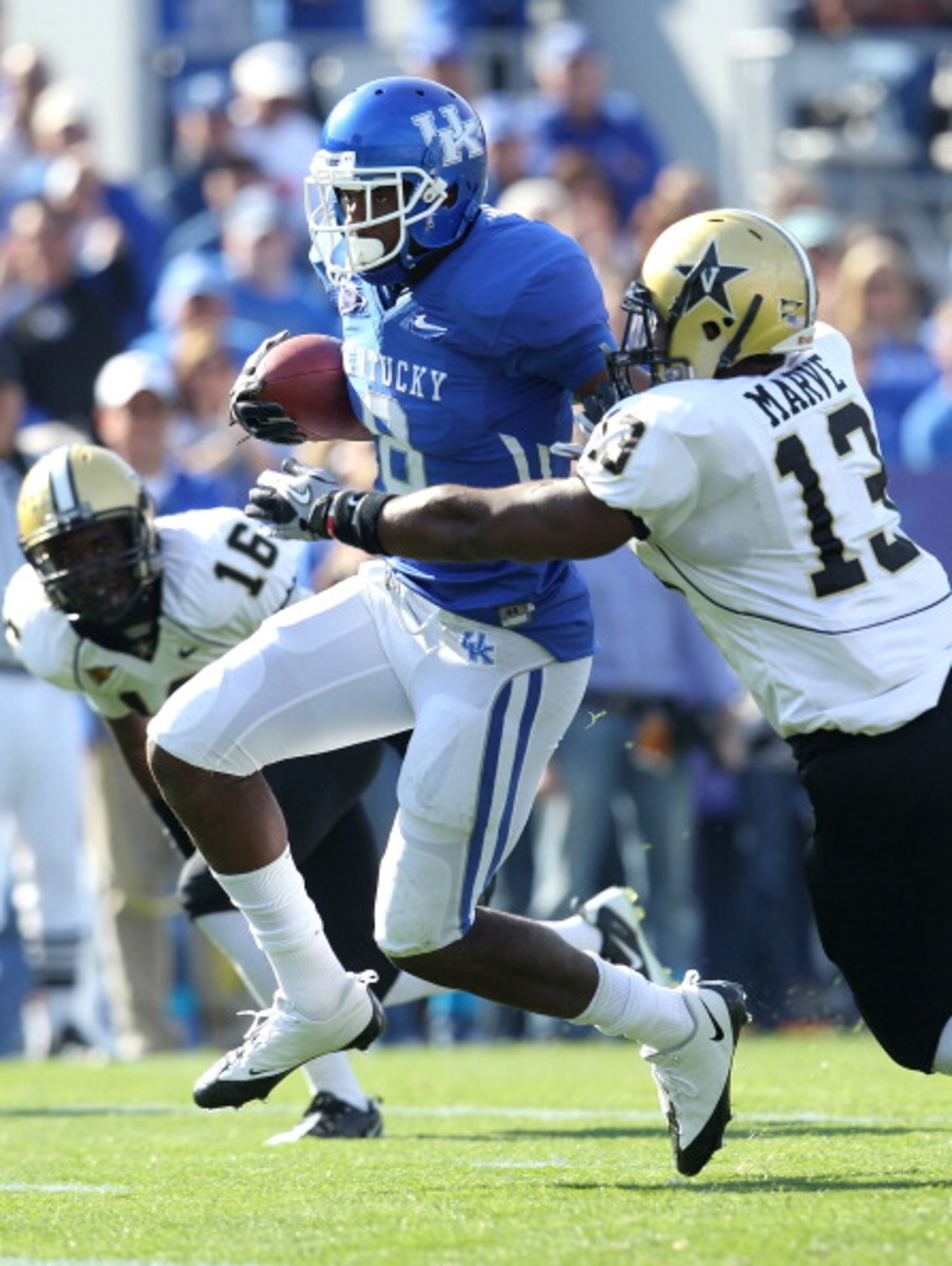 LEXINGTON, KY - NOVEMBER 13: Chris Matthews #8 of the Kentucky Wildcats runs with the ball while defended by Chris Marve #13 of the Vanderbilt Commodores at Commonwealth Stadium on November 13, 2010 in Lexington, Kentucky. (Photo by Andy Lyons/Getty Ima LEXINGTON, KY - NOVEMBER 13: Chris Matthews #8 of the Kentucky Wildcats runs with the ball while defended by Chris Marve #13 of the Vanderbilt Commodores at Commonwealth Stadium on November 13, 2010 in Lexington, Kentucky. (Photo by Andy Lyons/Getty Ima