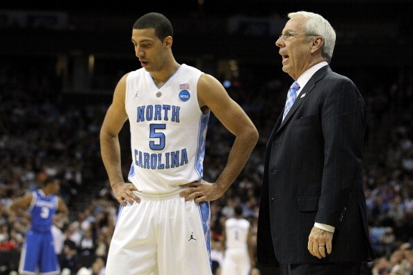 NEWARK, NJ - MARCH 27:  Kendall Marshall #5 of the North Carolina Tar Heels talks with head coach Roy Williams during the first half of the game against the Kentucky Wildcats in the east regional final of the 2011 NCAA men's basketball tournament at Prude