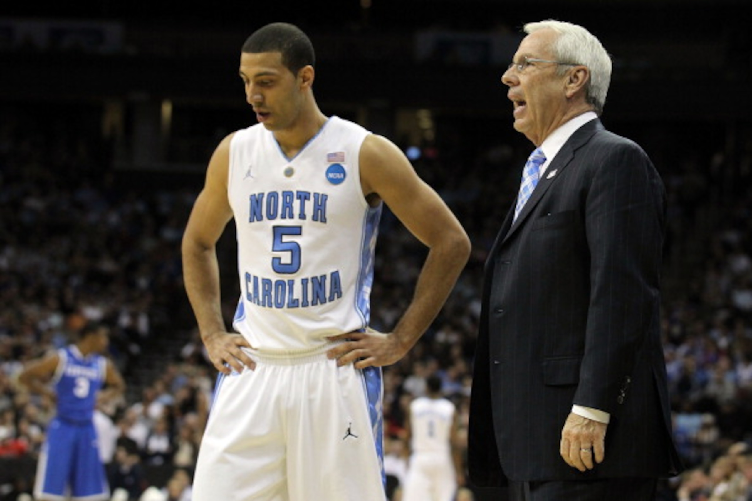 NEWARK, NJ - MARCH 27:  Kendall Marshall #5 of the North Carolina Tar Heels talks with head coach Roy Williams during the first half of the game against the Kentucky Wildcats in the east regional final of the 2011 NCAA men's basketball tournament at Prude