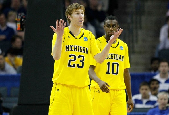CHARLOTTE, NC - MARCH 20:  Evan Smotrycz #23 and Tim Hardaway Jr. #10 of the Michigan Wolverines react while taking on the Duke Blue Devils during the third round of the 2011 NCAA men's basketball tournament at Time Warner Cable Arena on March 20, 2011 in