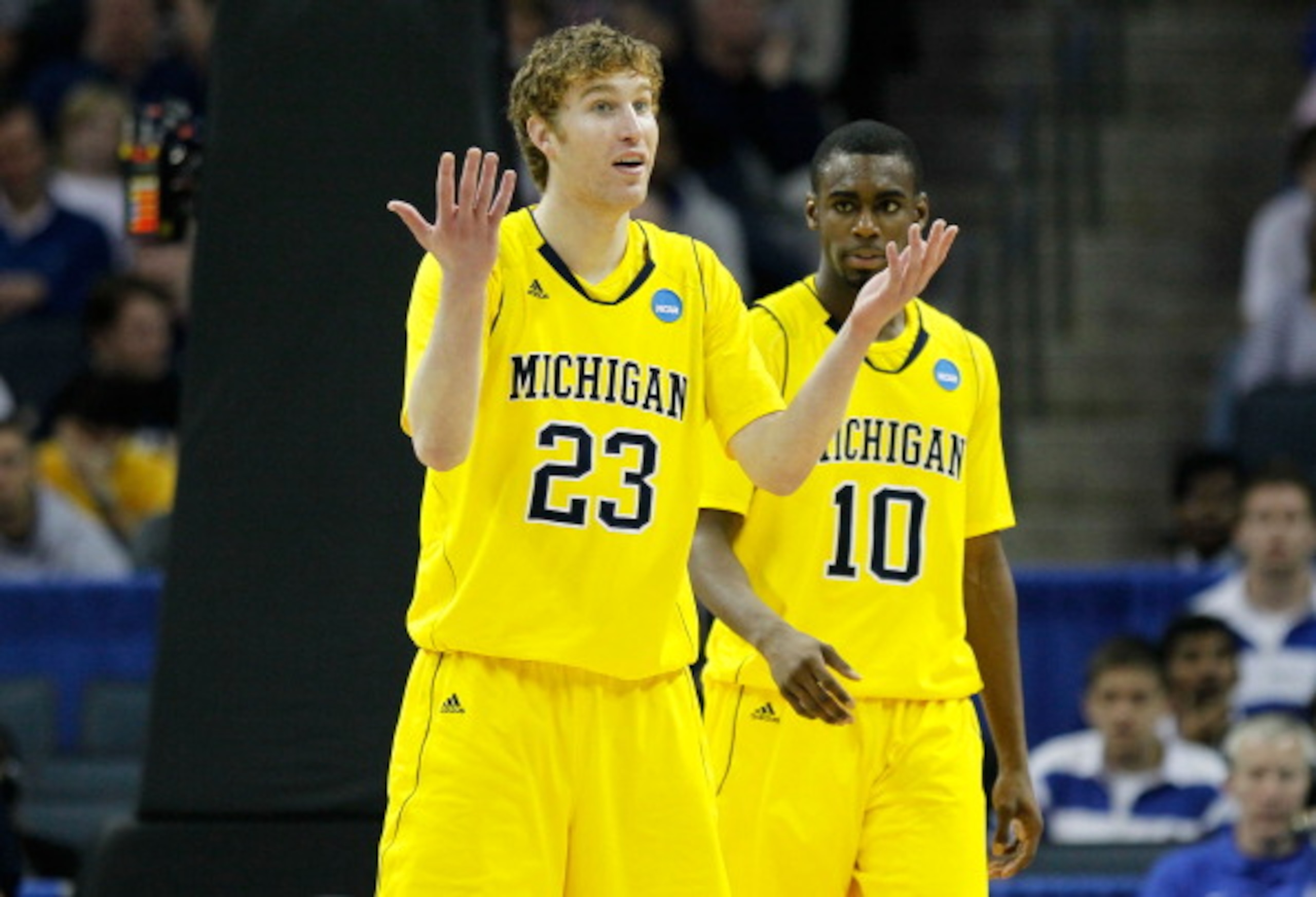 CHARLOTTE, NC - MARCH 20:  Evan Smotrycz #23 and Tim Hardaway Jr. #10 of the Michigan Wolverines react while taking on the Duke Blue Devils during the third round of the 2011 NCAA men's basketball tournament at Time Warner Cable Arena on March 20, 2011 in