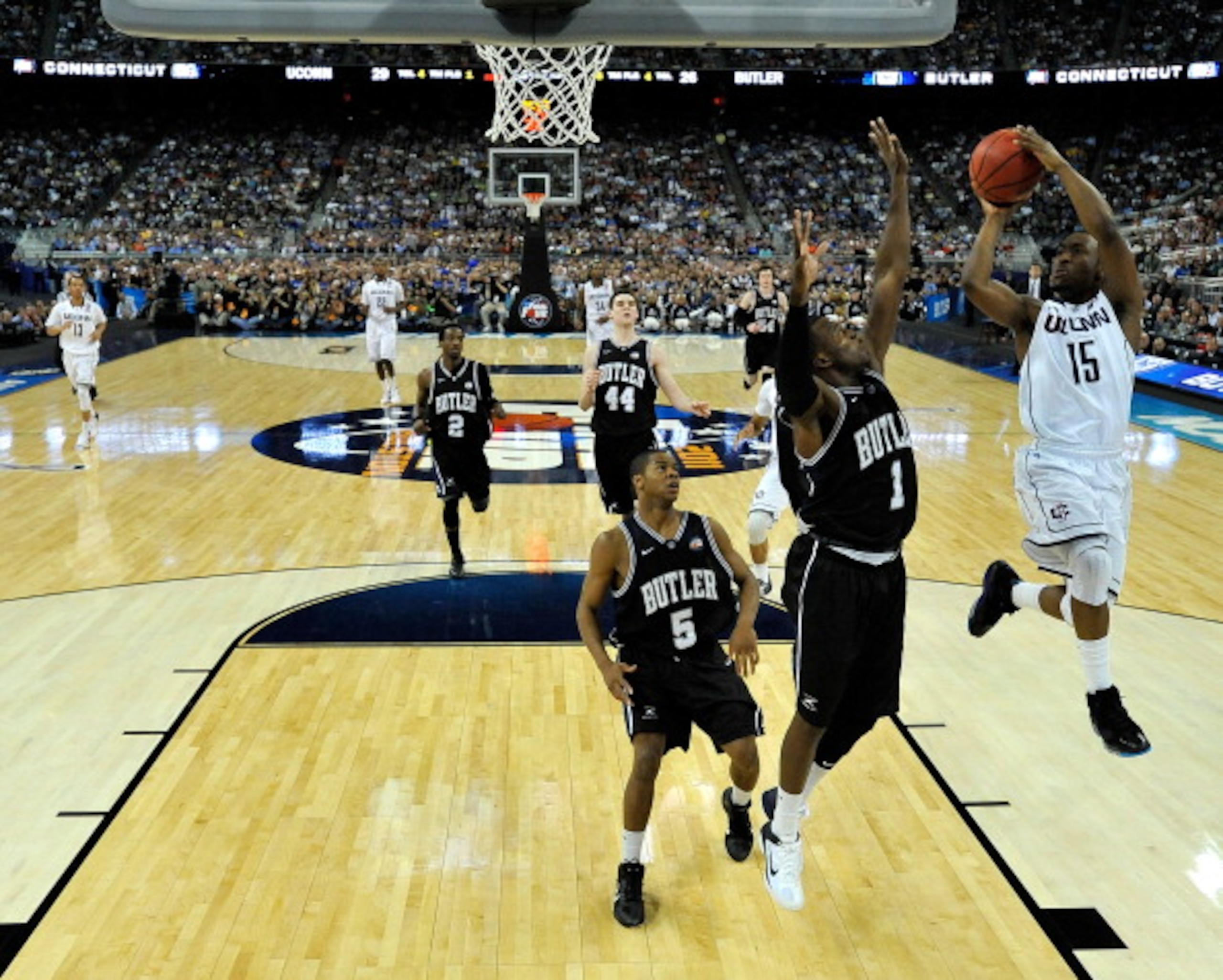 HOUSTON, TX - APRIL 04: Kemba Walker #15 of the Connecticut Huskies goes to the basket against Shelvin Mack #1 of the Butler Bulldogs during the National Championship Game of the 2011 NCAA Division I Men's Basketball Tournament at Reliant Stadium on Apri HOUSTON, TX - APRIL 04: Kemba Walker #15 of the Connecticut Huskies goes to the basket against Shelvin Mack #1 of the Butler Bulldogs during the National Championship Game of the 2011 NCAA Division I Men's Basketball Tournament at Reliant Stadium on Apri