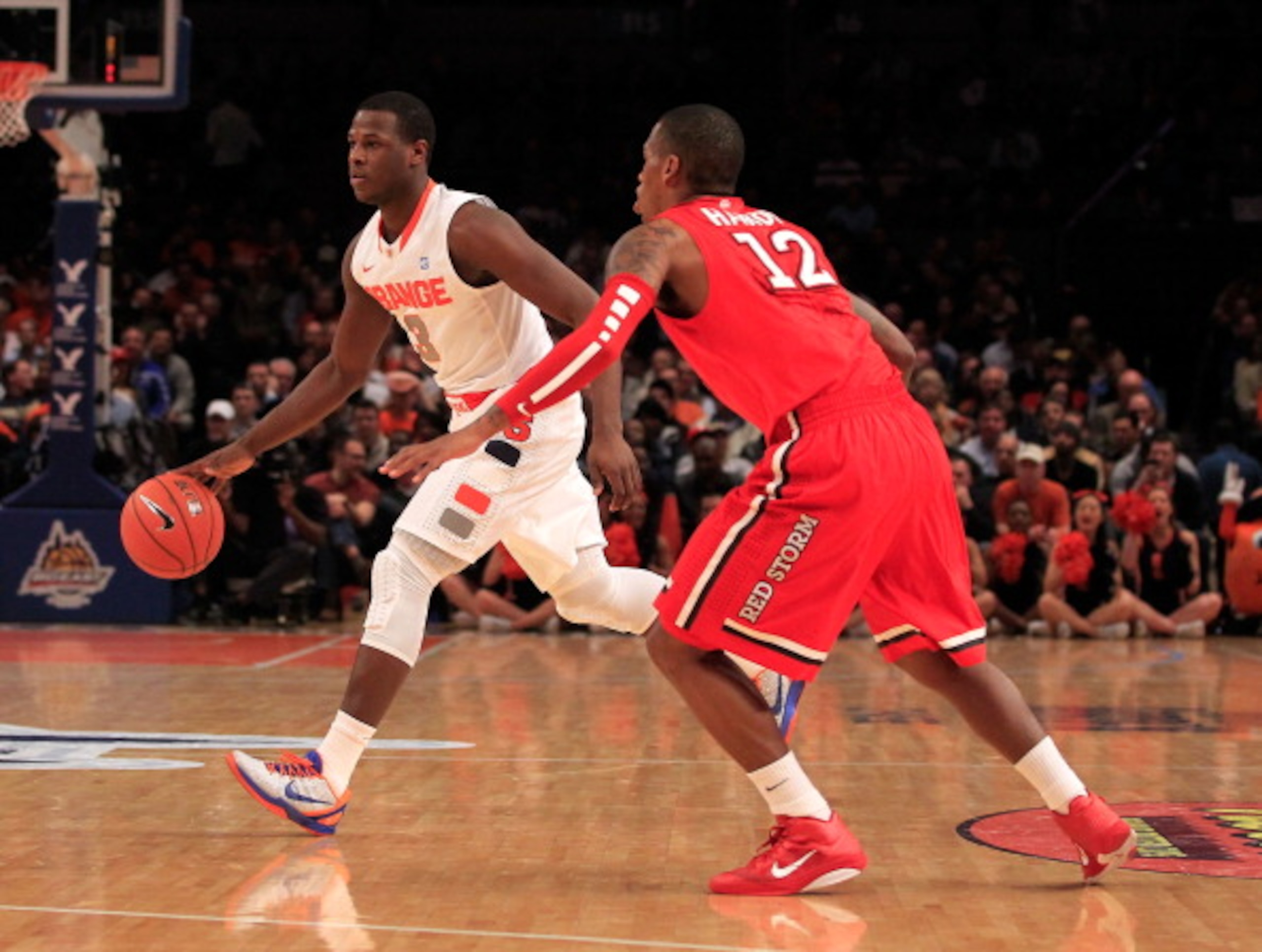 NEW YORK, NY - MARCH 10: Dion Waiters #3 of the Syracuse Orange handles the ball against Dwight Hardy #12 of the St. John's Red Storm during the quarterfinals of the 2011 Big East Men's Basketball Tournament presented by American Eagle Outfitters at Madi NEW YORK, NY - MARCH 10: Dion Waiters #3 of the Syracuse Orange handles the ball against Dwight Hardy #12 of the St. John's Red Storm during the quarterfinals of the 2011 Big East Men's Basketball Tournament presented by American Eagle Outfitters at Madi