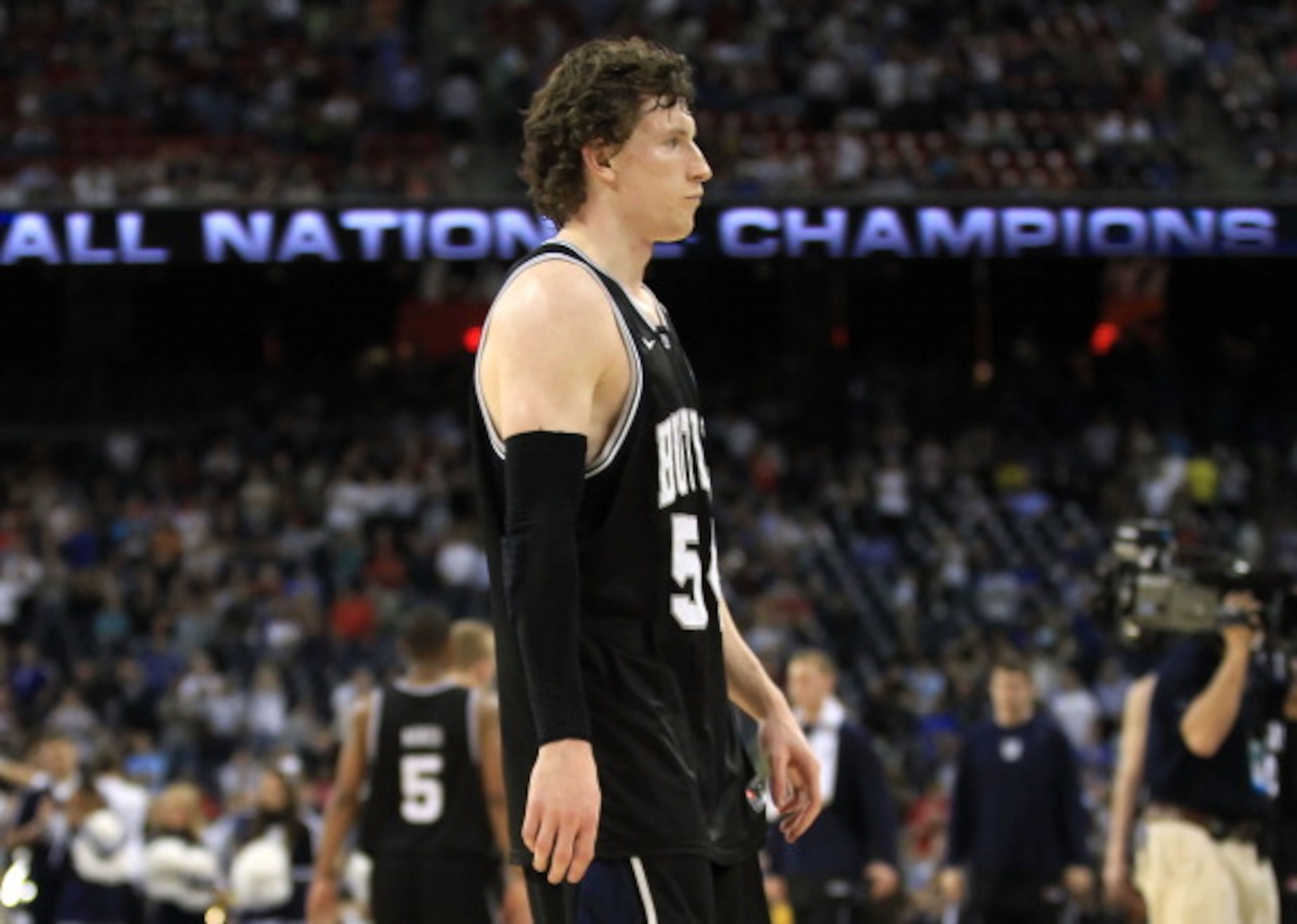 HOUSTON, TX - APRIL 04: Matt Howard #54 of the Butler Bulldogs walks off of the court after losing to the Connecticut Huskies in the National Championship Game of the 2011 NCAA Division I Men's Basketball Tournament at Reliant Stadium on April 4, 2011 in HOUSTON, TX - APRIL 04: Matt Howard #54 of the Butler Bulldogs walks off of the court after losing to the Connecticut Huskies in the National Championship Game of the 2011 NCAA Division I Men's Basketball Tournament at Reliant Stadium on April 4, 2011 in