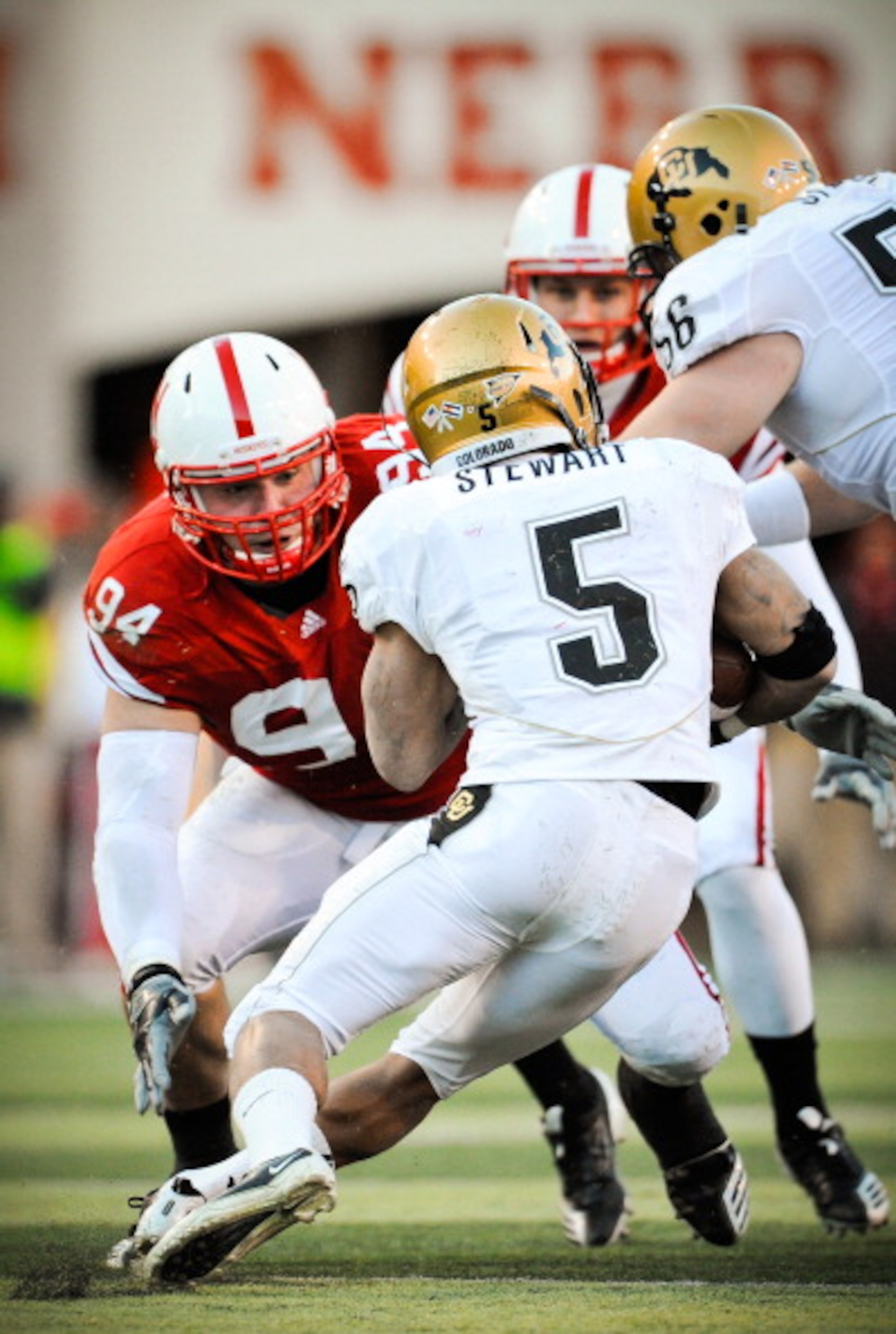 LINCOLN, NE - NOVEMBER 26: Jared Crick #94 of the Nebraska Cornhuskers zero in on for Rodney Stewart #5 of the Colorado Buffaloes during their game at Memorial Stadium on November 26, 2010 in Lincoln, Nebraska. Nebraska defeated Colorado 45-17 (Photo by E