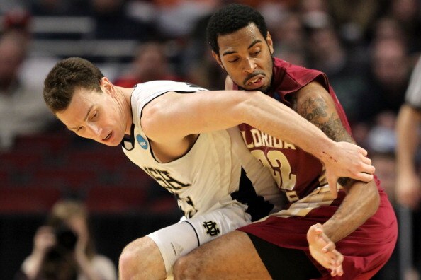 CHICAGO, IL - MARCH 20: Derwin Kitchen #22 of the Florida State Seminoles reaches for the ball against Ben Hansbrough #23 of the Notre Dame Fighting Irish in the second half during the third round of the 2011 NCAA men's basketball tournament at the United