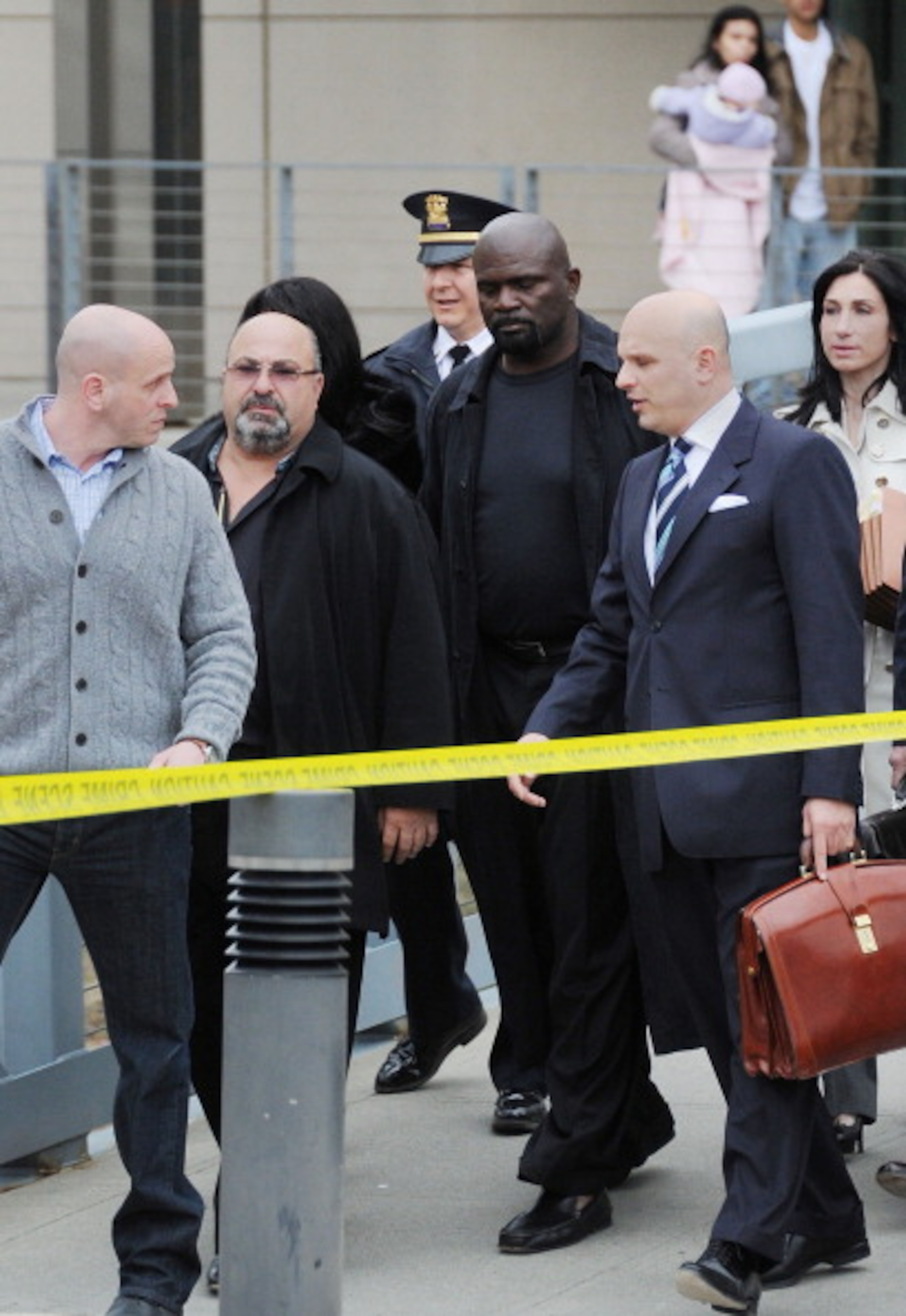 NEW CITY, NY - MARCH 22:  Former professional football player Lawrence Taylor (4rd from L) is seen leaving the courthouse after his hearing at Rockland County Courthouse on March 22, 2011 in New City, New York.  (Photo by Mike Coppola/Getty Images)