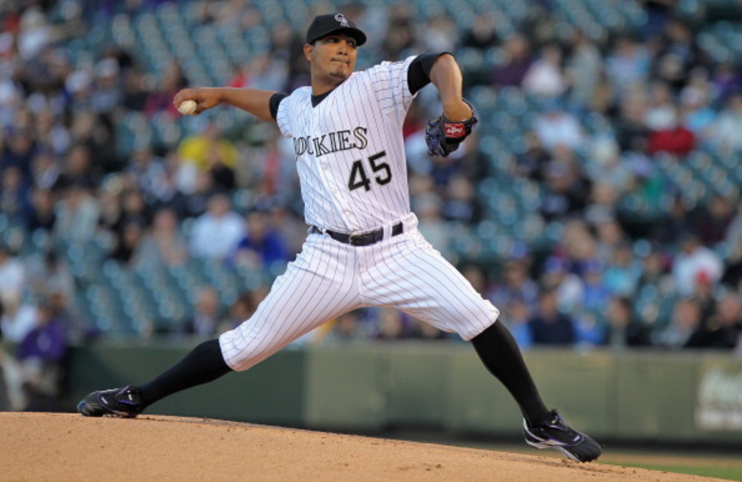 DENVER, CO - APRIL 05:  Starting pitcher Jhoulys Chacin #45 of the Colorado Rockies delivers against the Los Angeles Dodgers at Coors Field on April 5, 2011 in Denver, Colorado.  (Photo by Doug Pensinger/Getty Images)