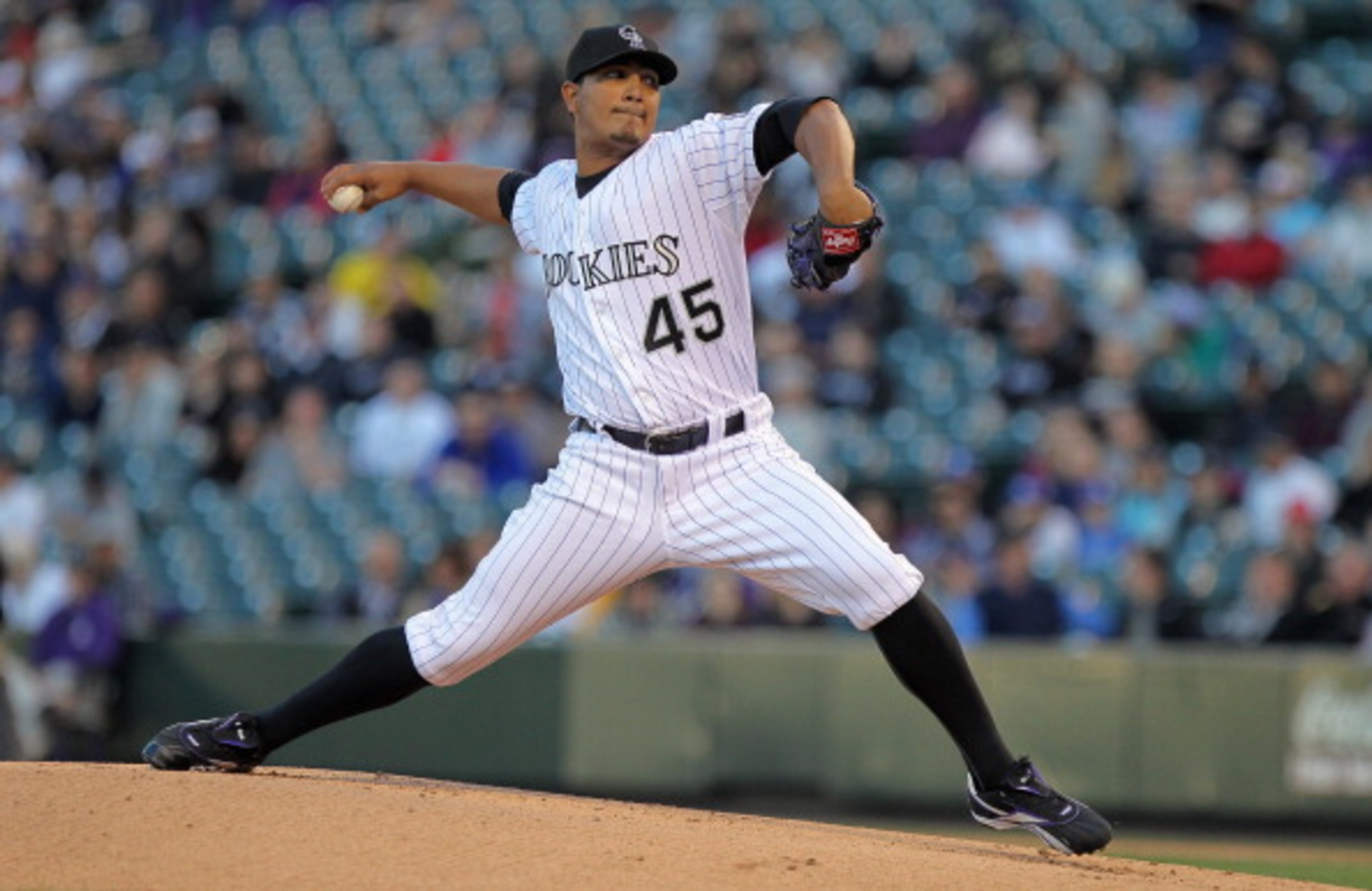 DENVER, CO - APRIL 05:  Starting pitcher Jhoulys Chacin #45 of the Colorado Rockies delivers against the Los Angeles Dodgers at Coors Field on April 5, 2011 in Denver, Colorado.  (Photo by Doug Pensinger/Getty Images)